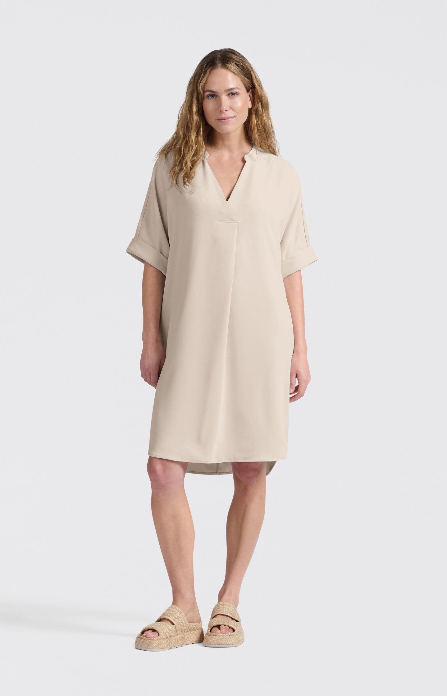 Flowy dress with V-neck and folded sleeves