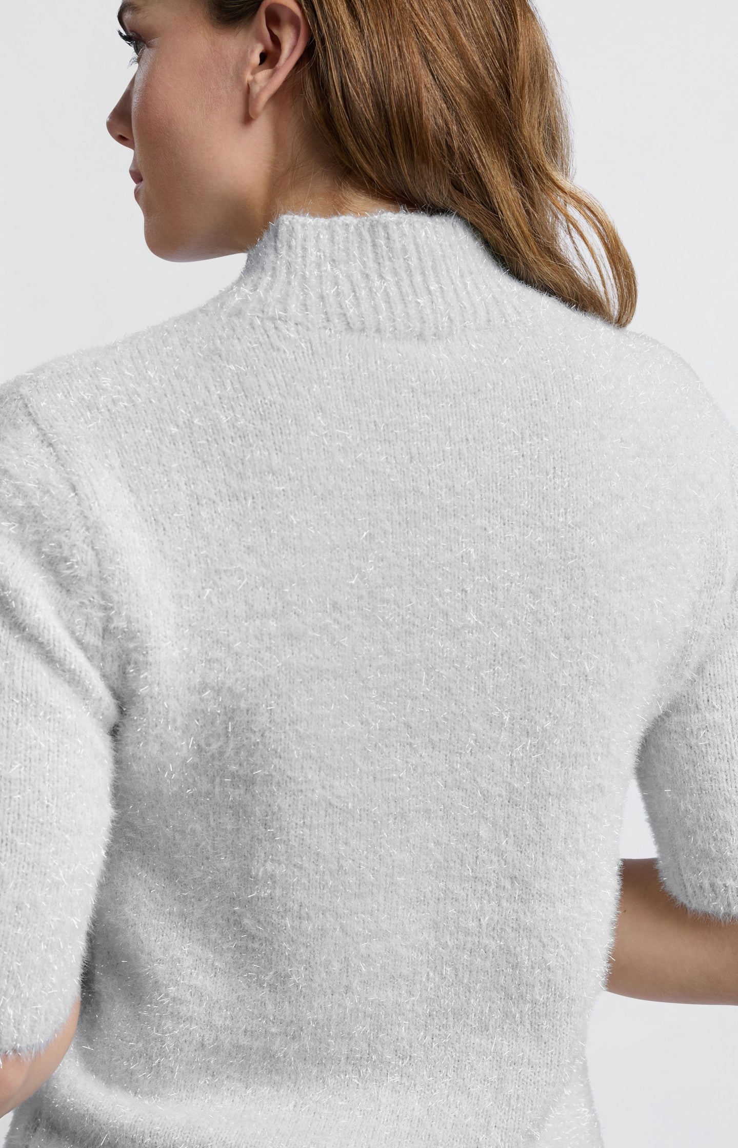 Fluffy sweater with half-length sleeves and a collar