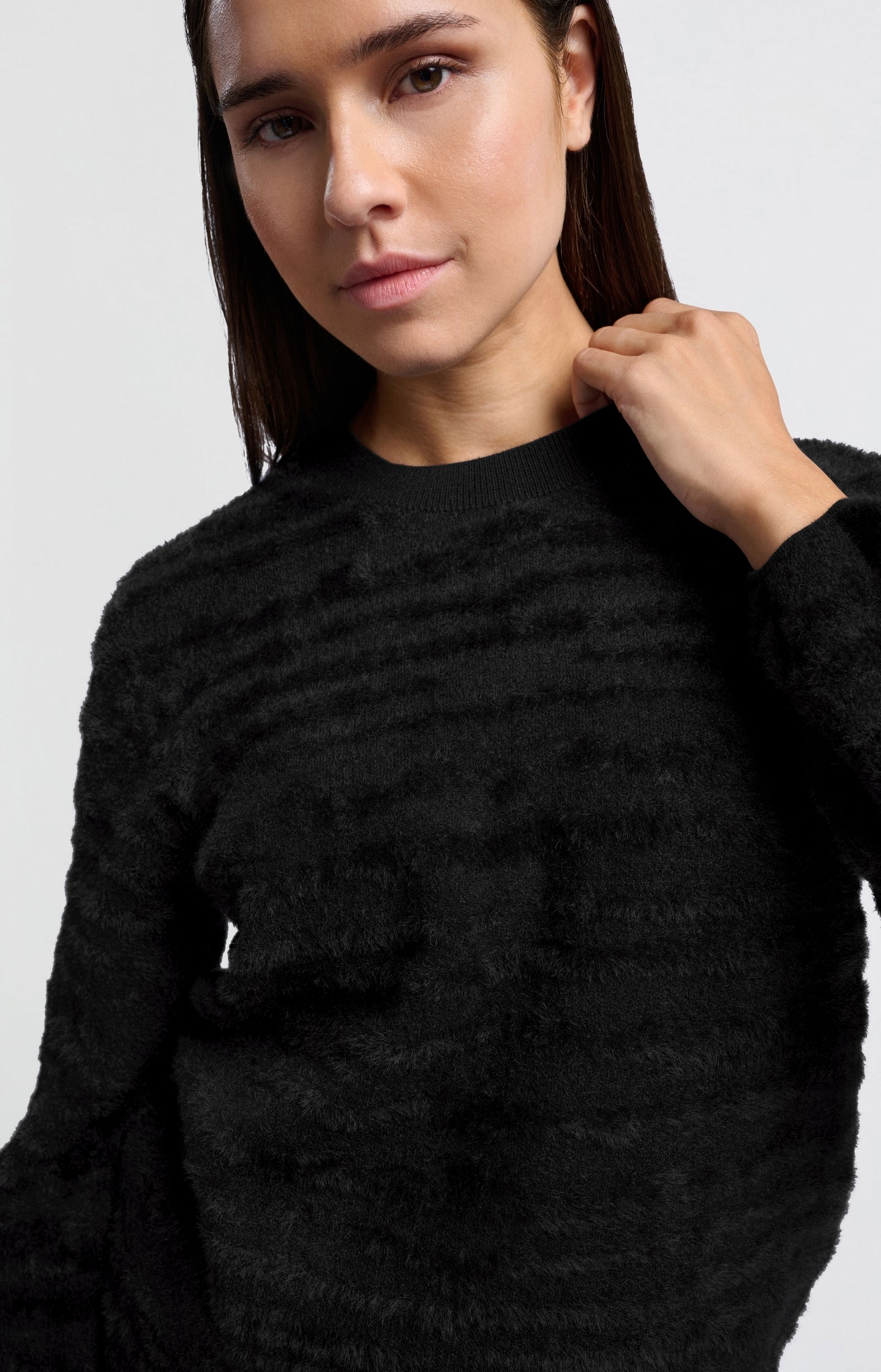 Fluffy sweater with round neckline and subtle stripes