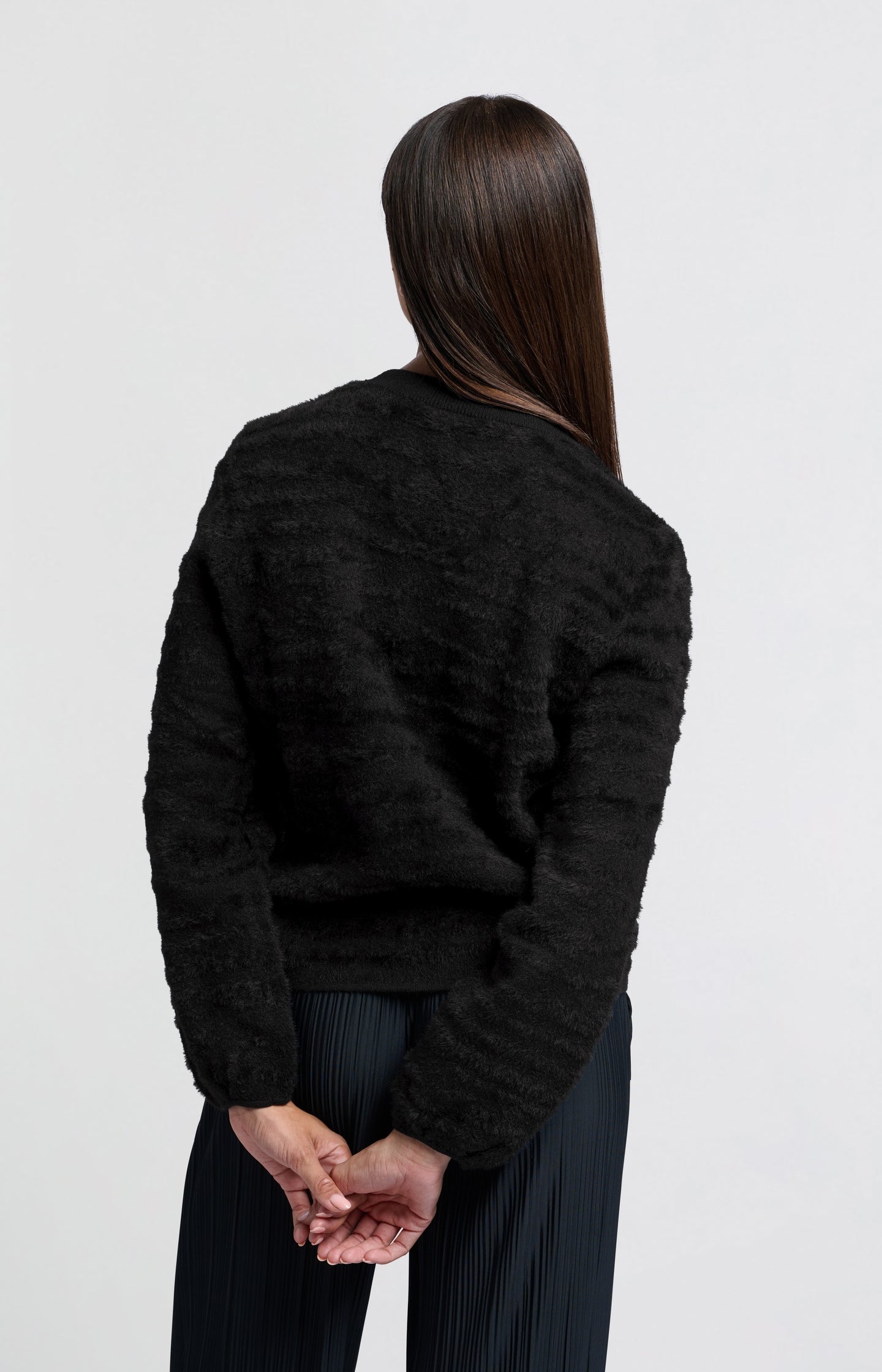 Fluffy sweater with round neckline and subtle stripes