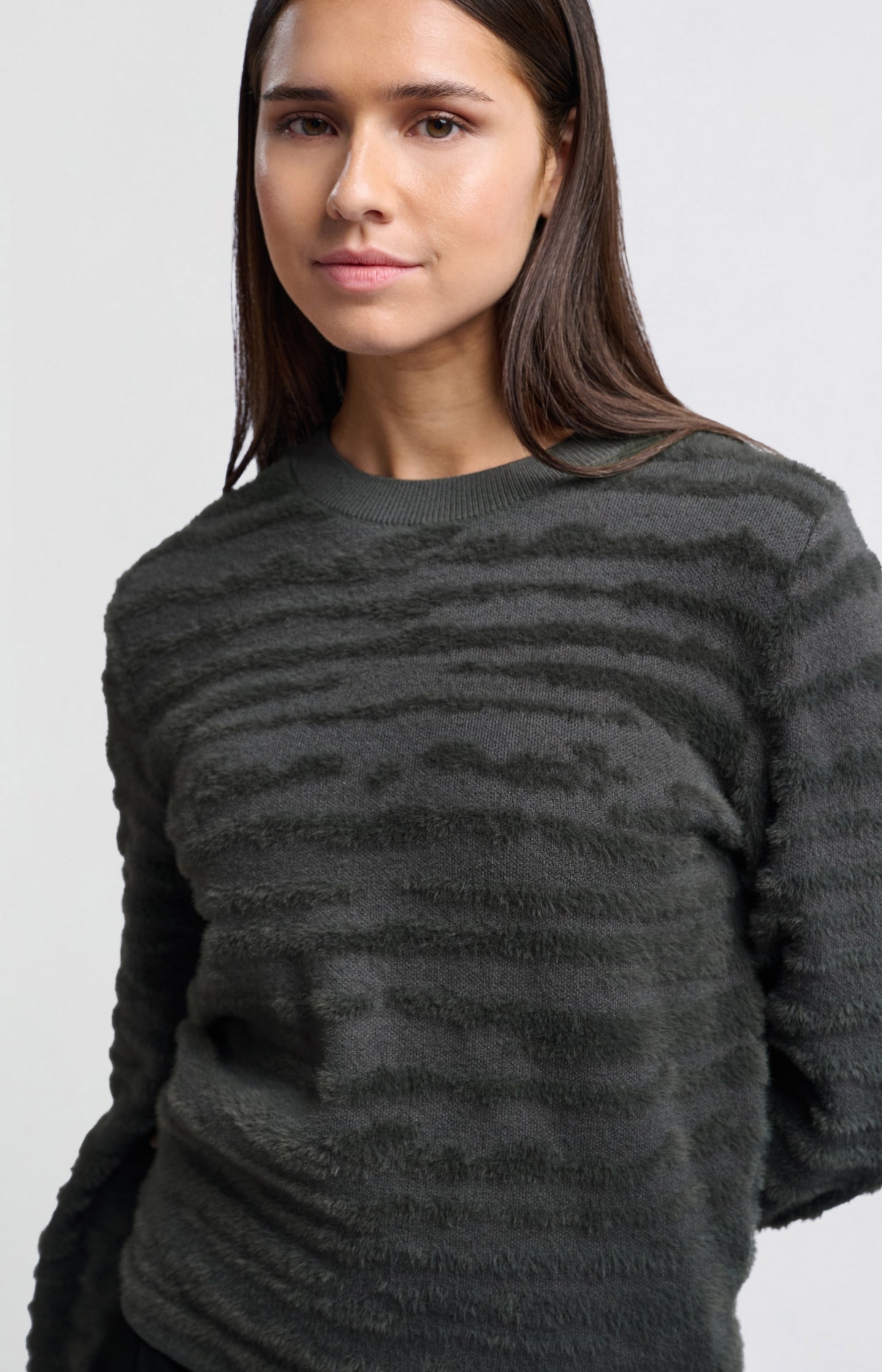 Fluffy sweater with round neckline and subtle stripes