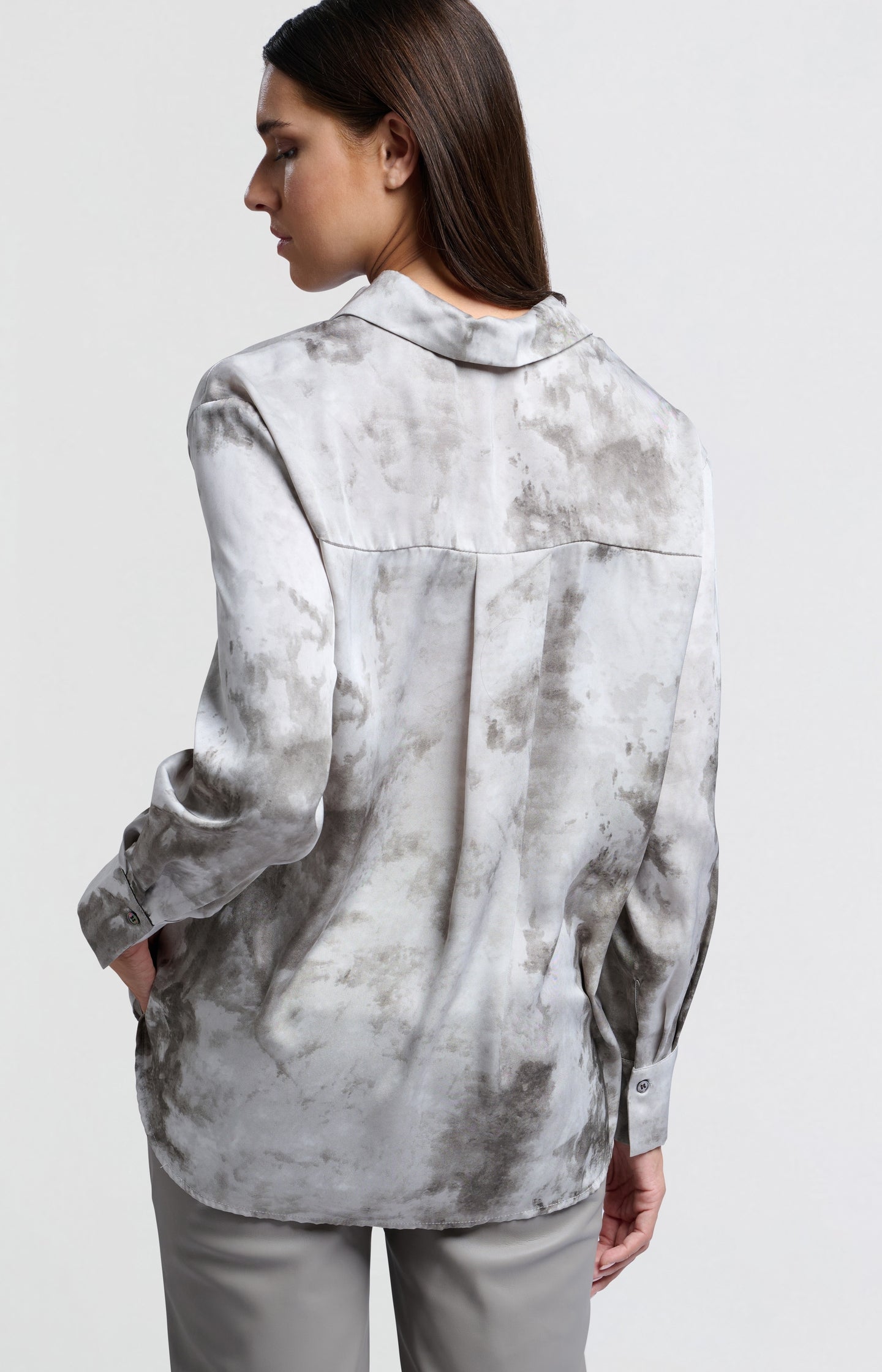 Grey blouse with abstract print and button closure