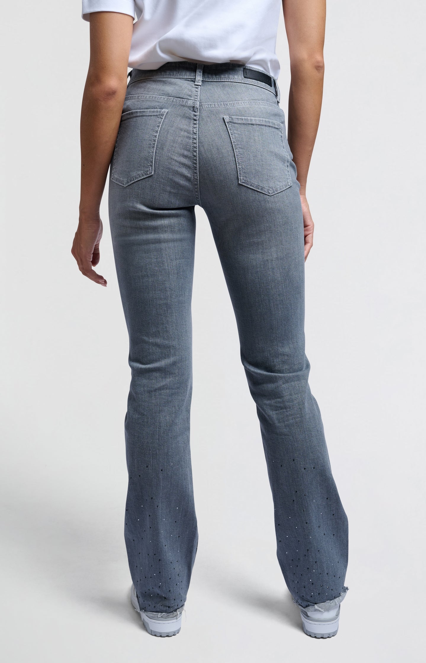 Grey flared denim jeans with rhinestones and high waist