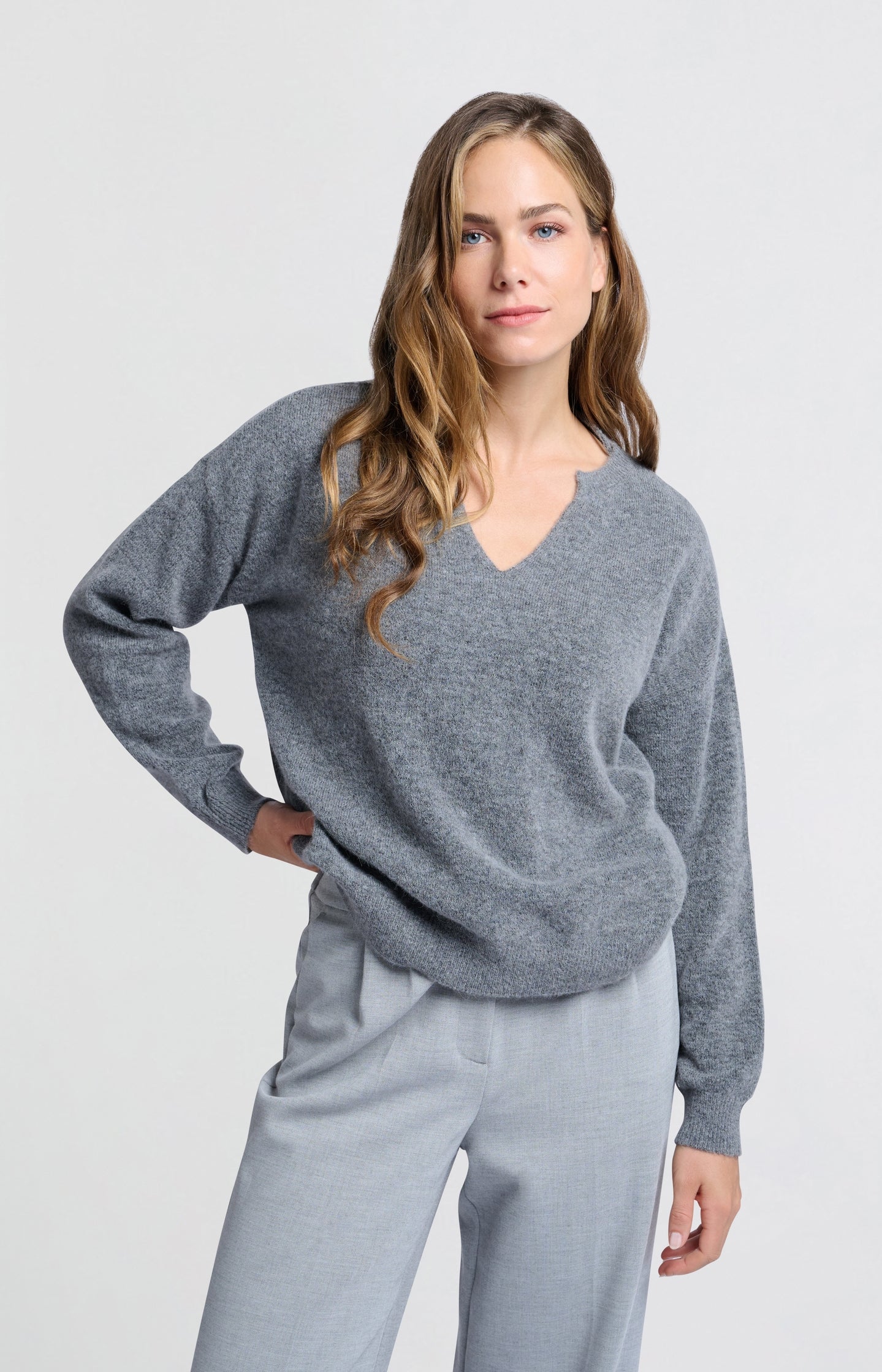 Grey sweater with V-neck and long sleeves