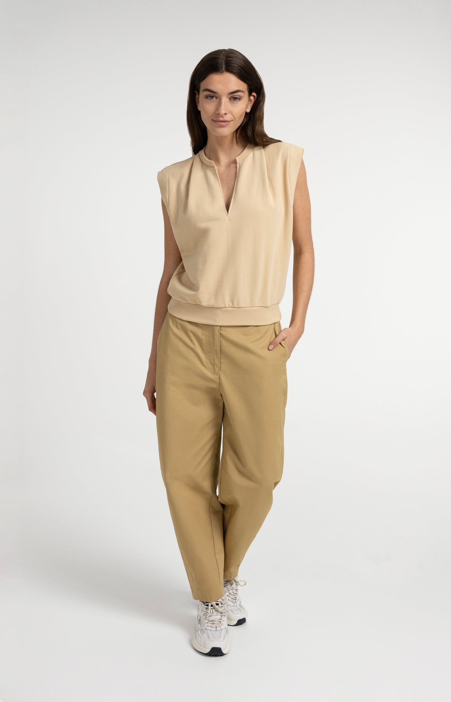 High-waist barrel-leg trousers with button detail