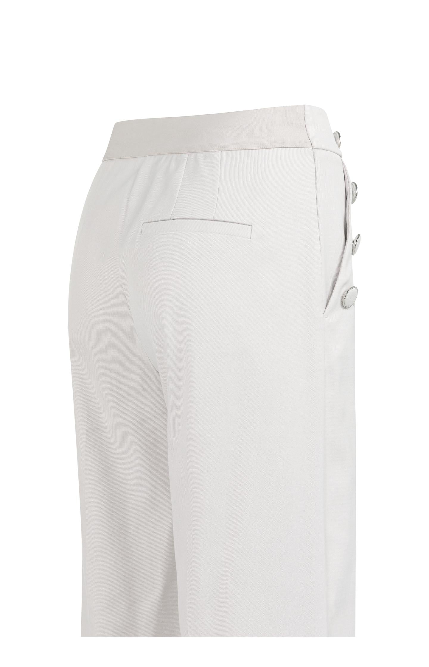 High waist trousers with decorative buttons and wide legs
