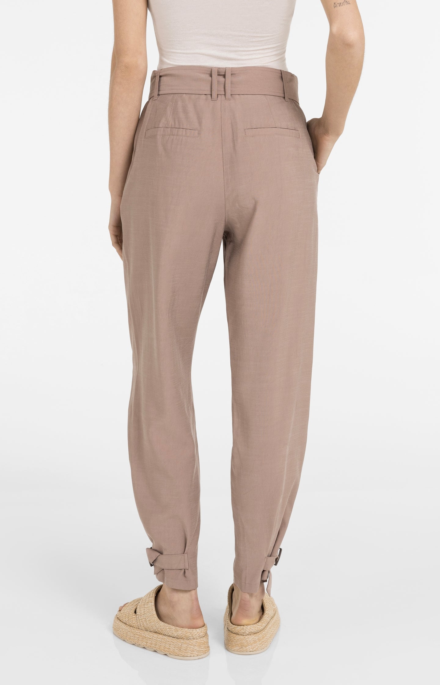 High waist trousers with strap details at the bottom hem