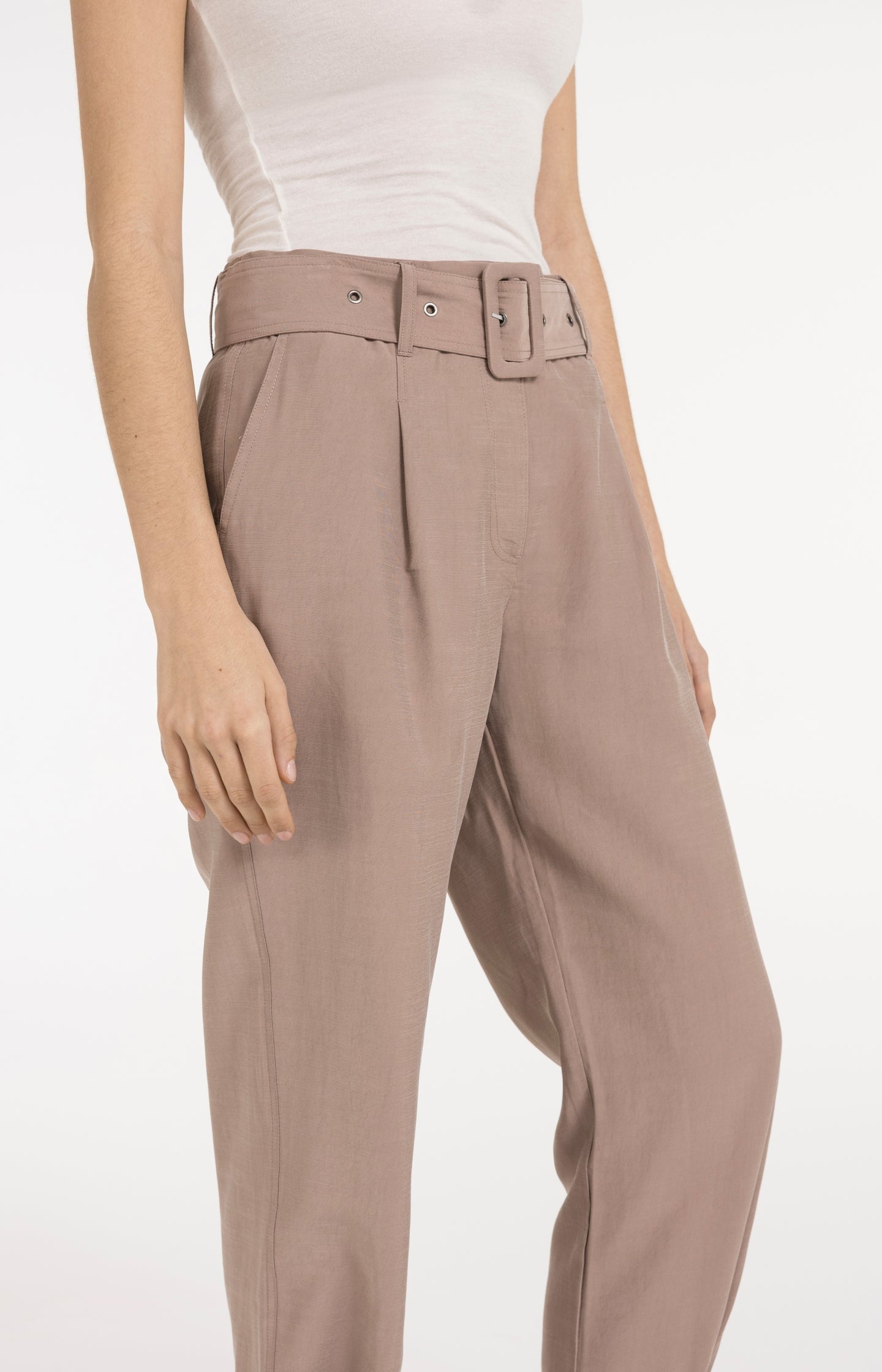 High waist trousers with strap details at the bottom hem