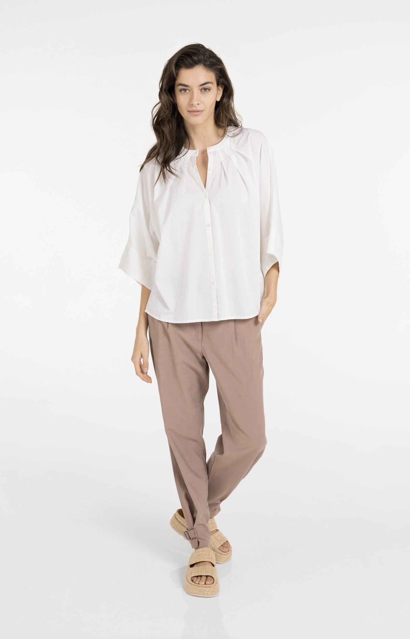 High waist trousers with strap details at the bottom hem