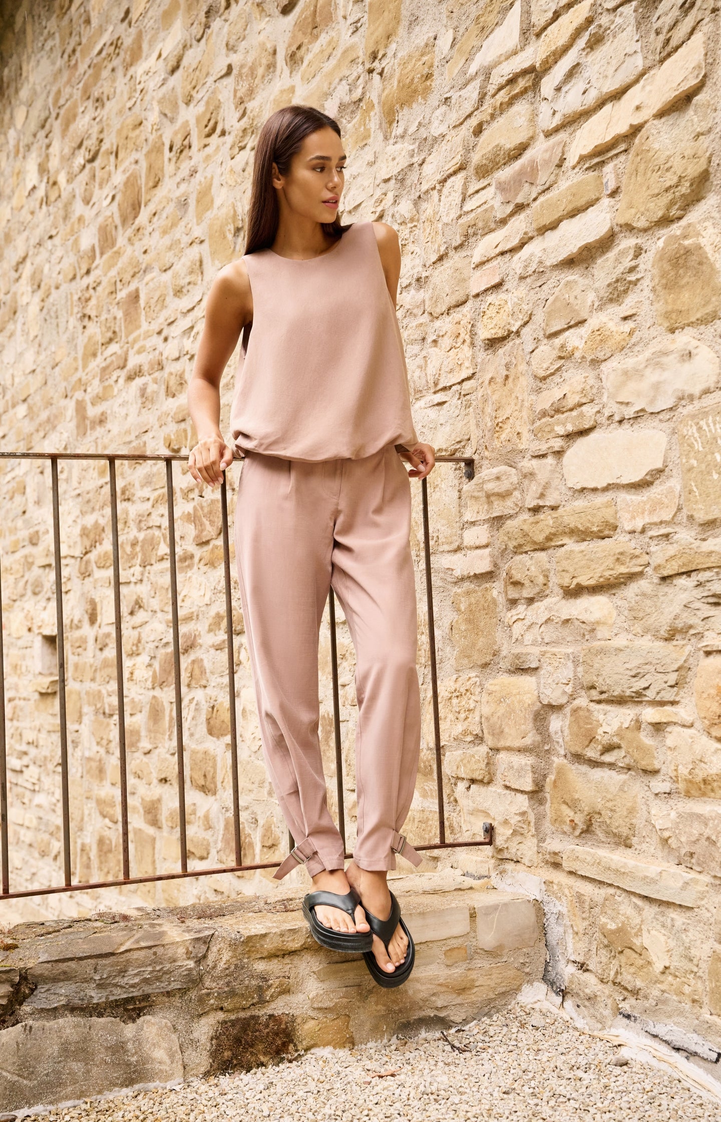 High waist trousers with strap details at the bottom hem