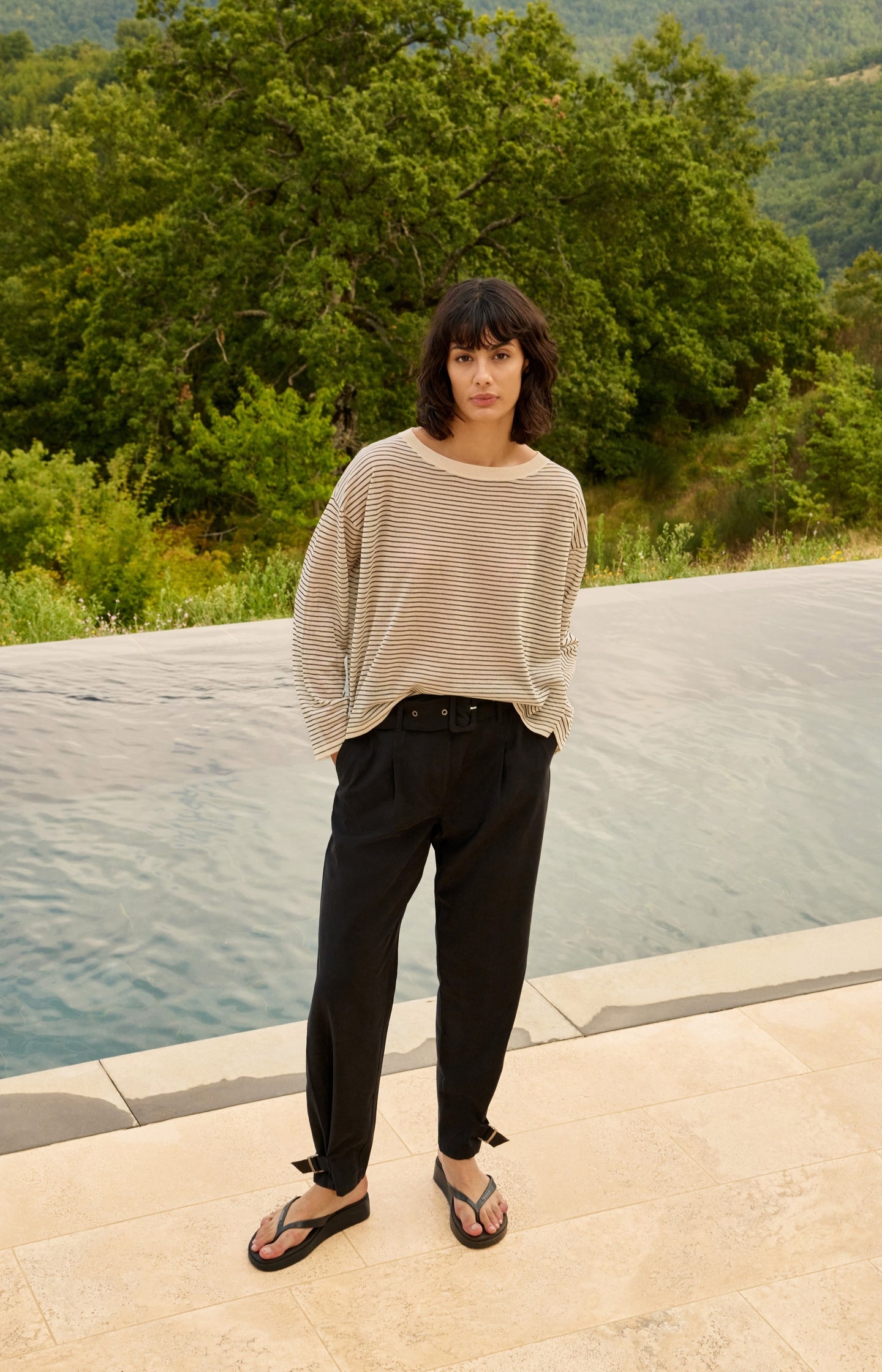 High waist trousers with strap details at the bottom hem - Type: lookbook