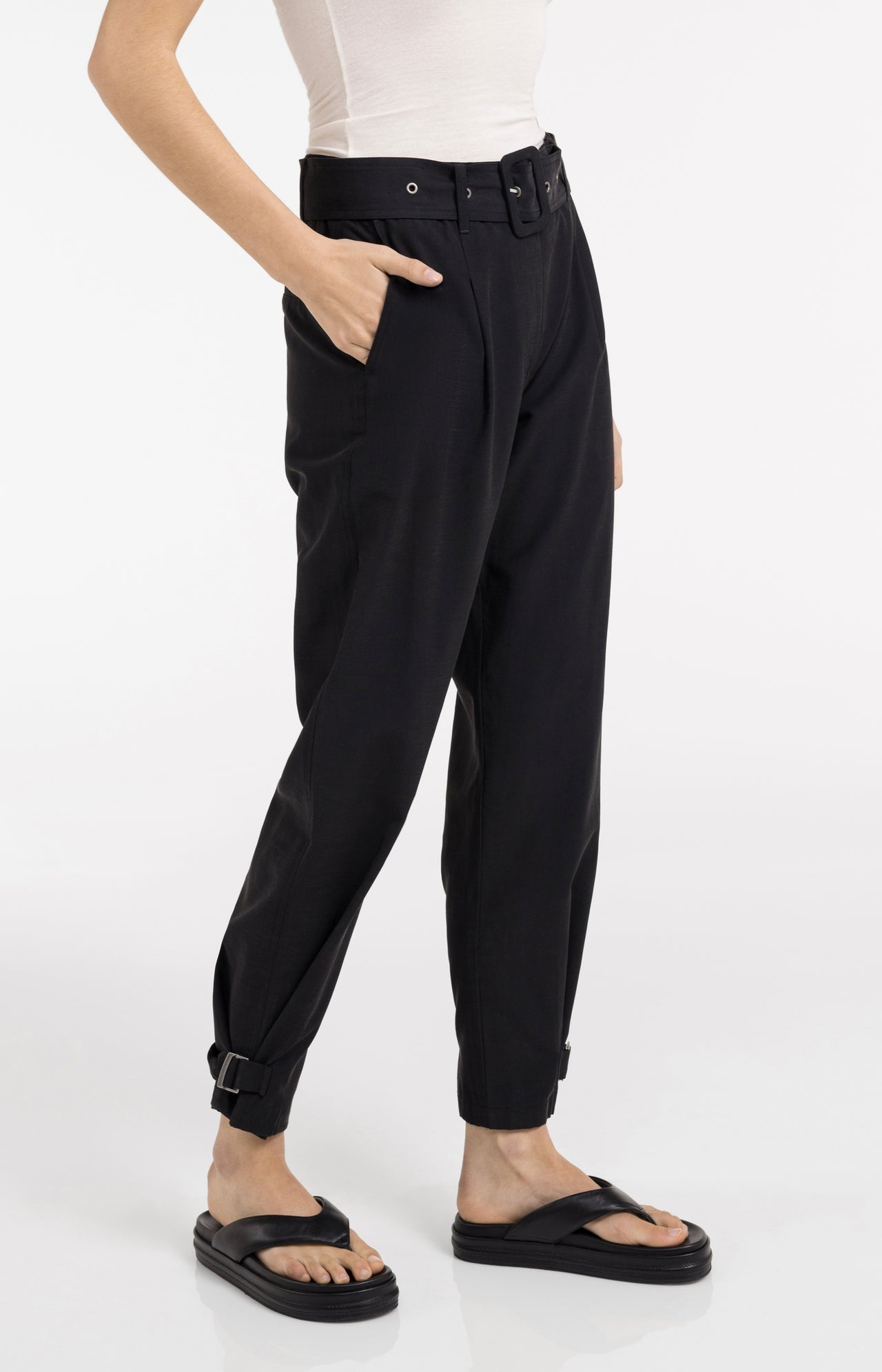 High waist trousers with strap details at the bottom hem