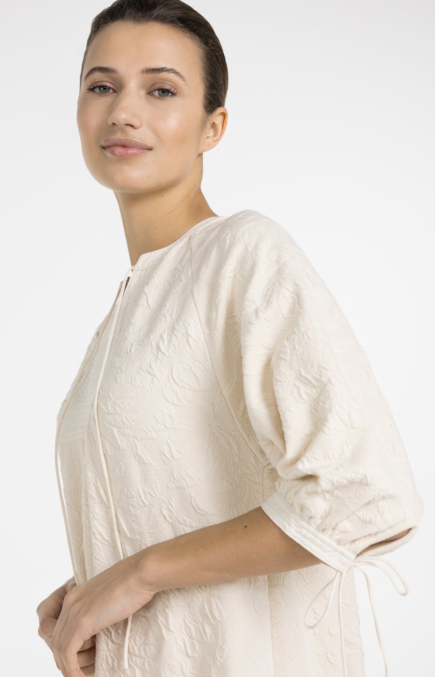 Jersey dress with texture and drawstring details