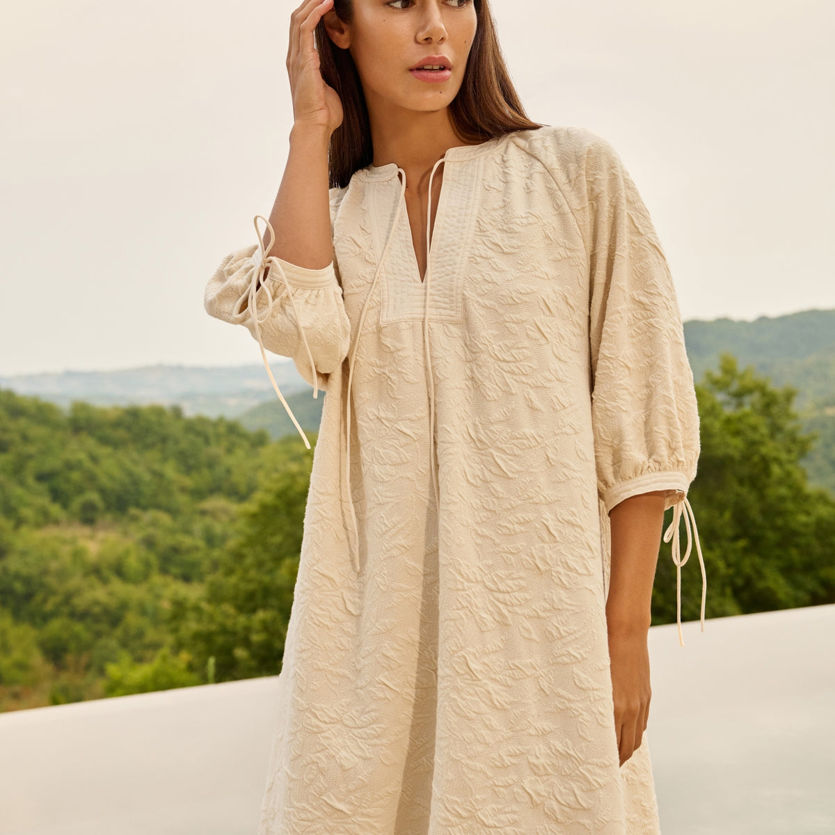 Jersey dress with texture and drawstring details