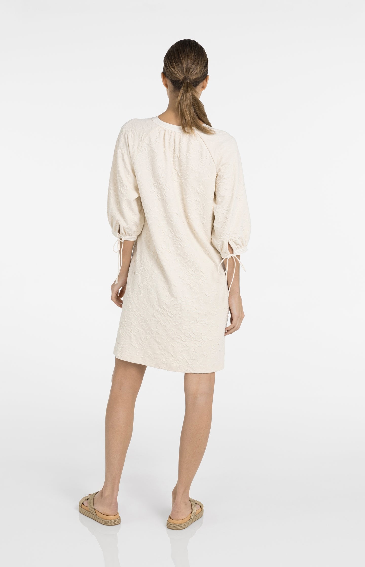 Jersey dress with texture and drawstring details