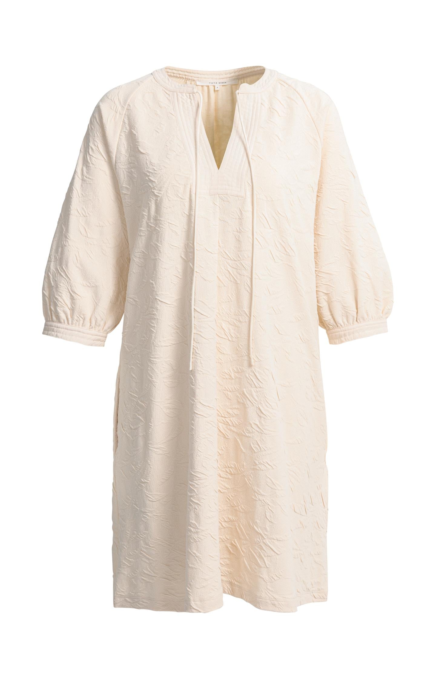 Jersey dress with texture and drawstring details