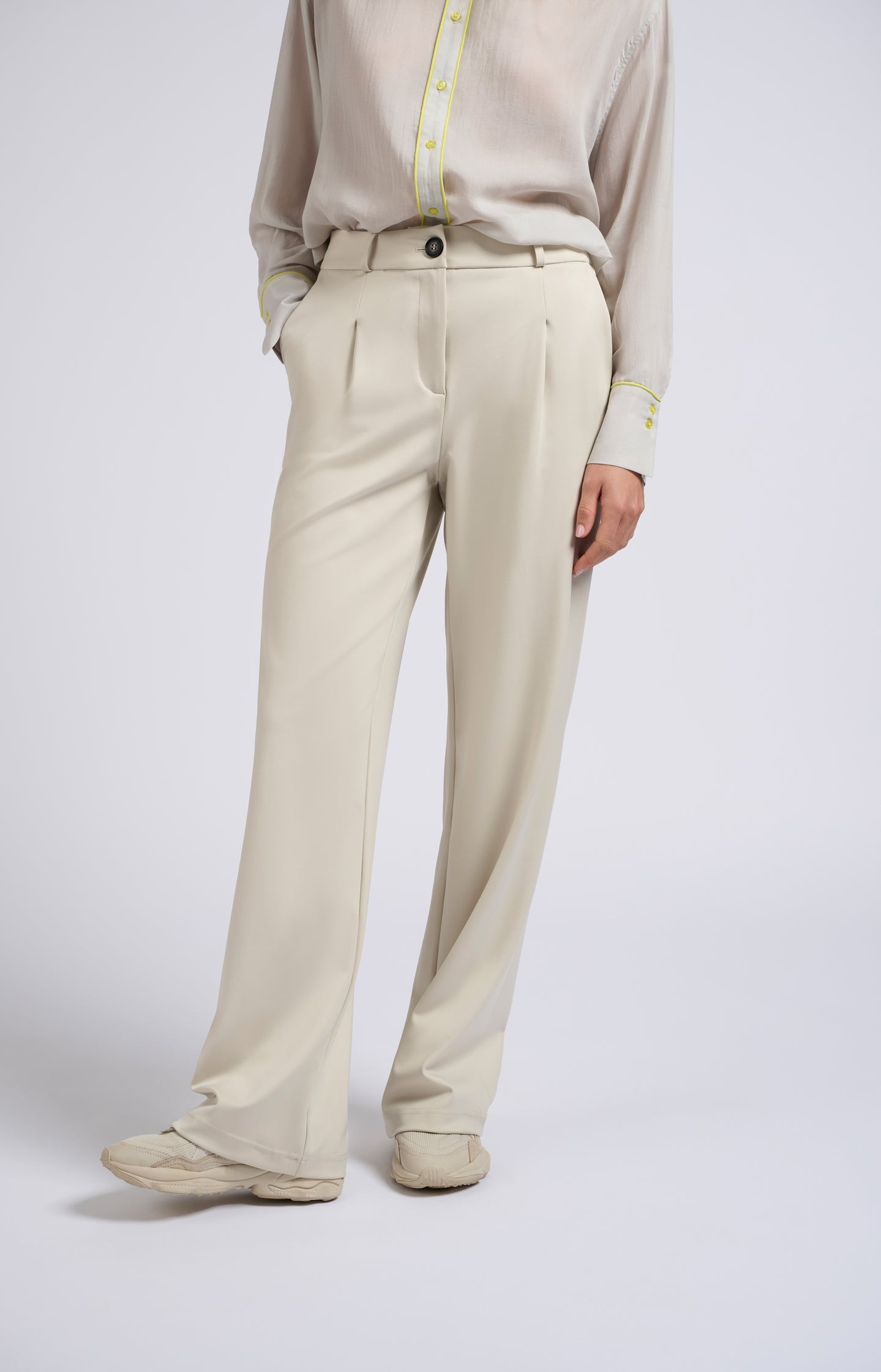 Jersey trousers with wide legs and pleated details