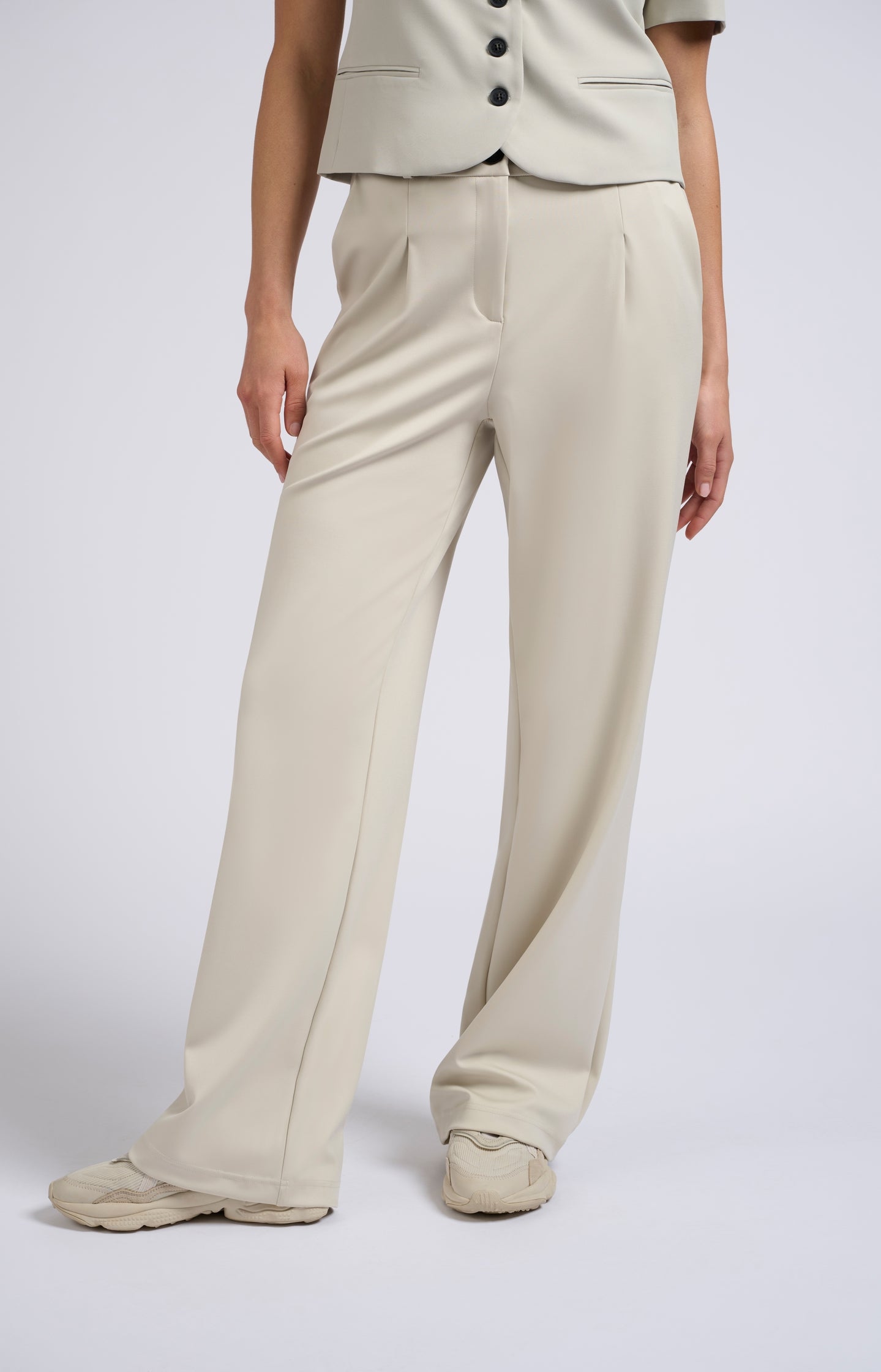 Jersey trousers with wide legs and pleated details