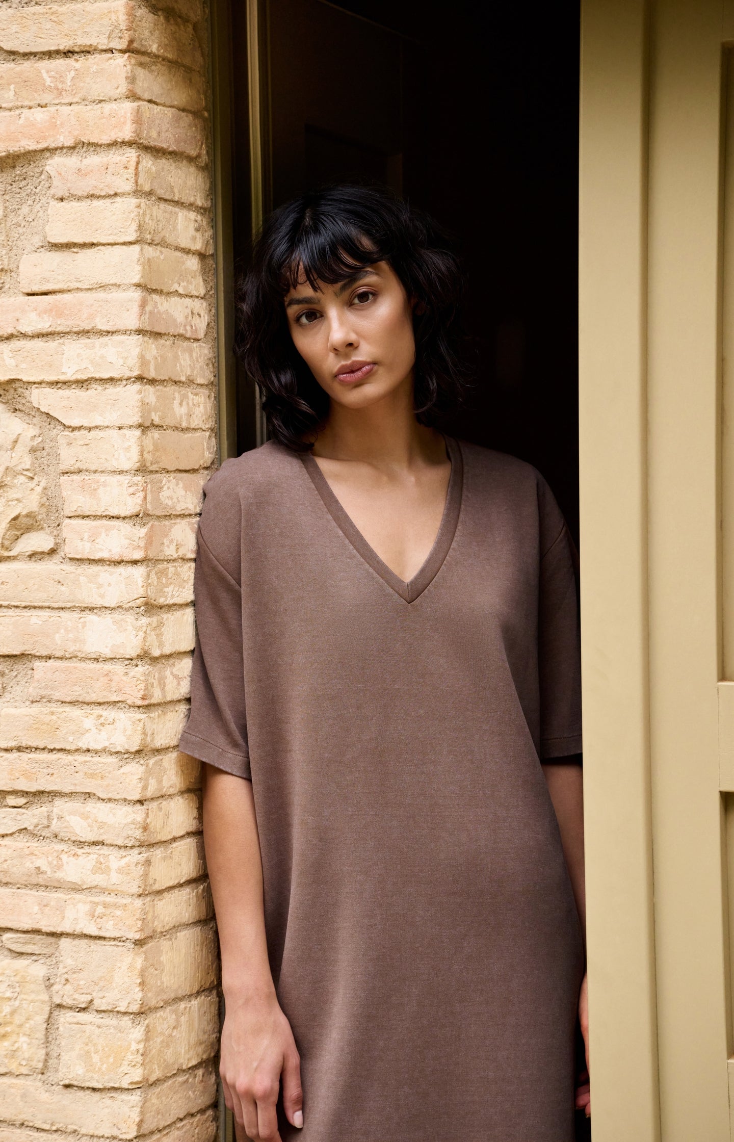 Jersey V-neck dress with washed look and tie belt