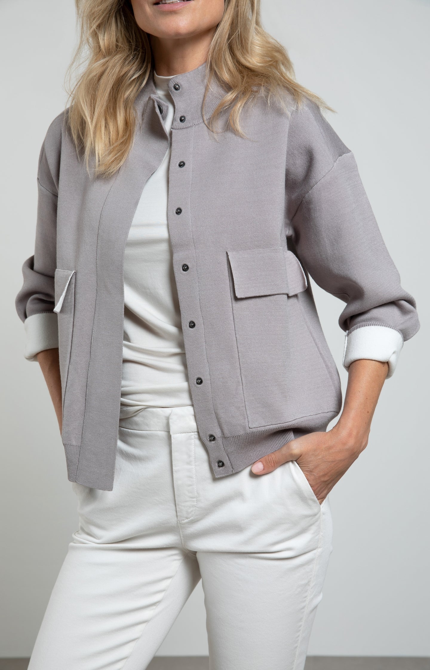 Knitted bomber jacket with long sleeves and blind placket