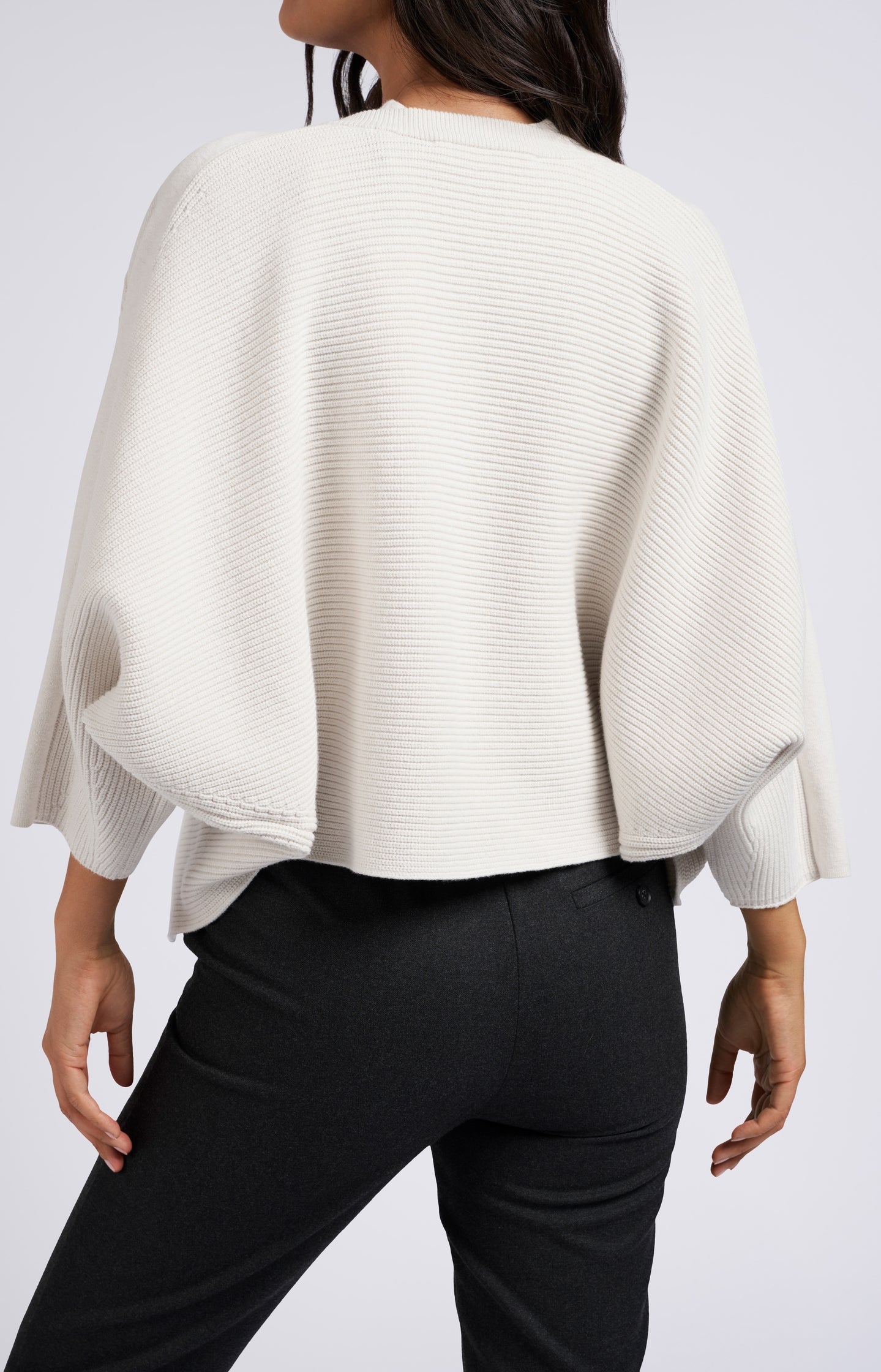 Knitted cardigan with three-quarter sleeves and a round neck