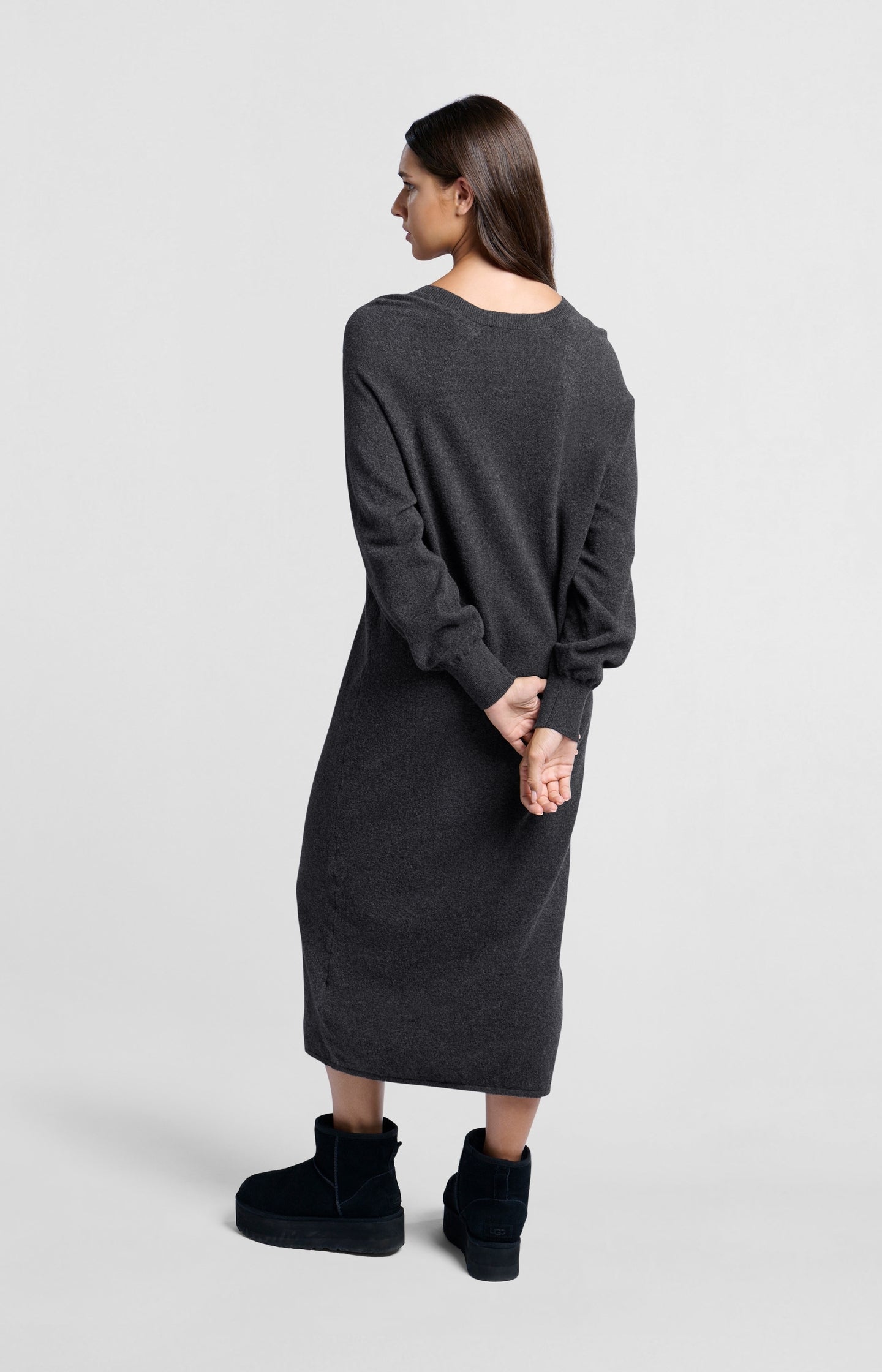 Knitted dark gray dress with V-neck and long sleeves