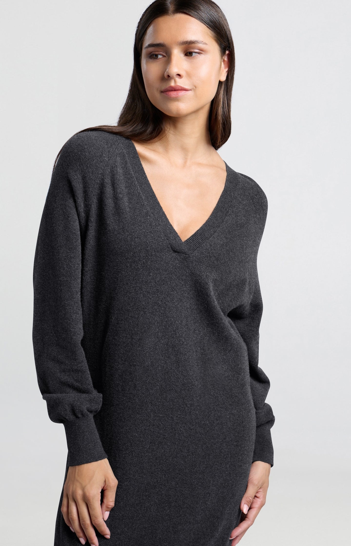 Knitted dark gray dress with V-neck and long sleeves