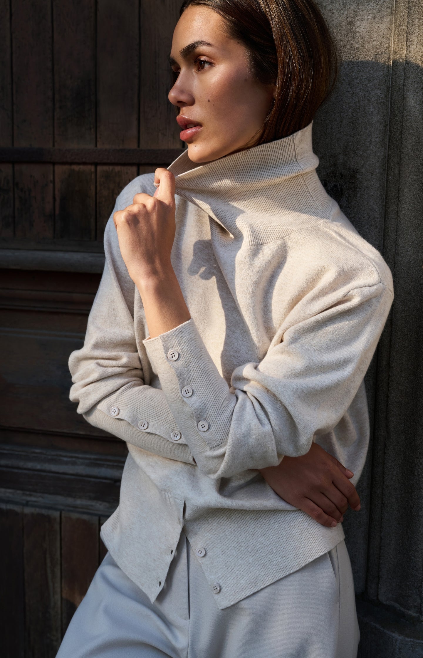 Knitted high neck sweater with button details