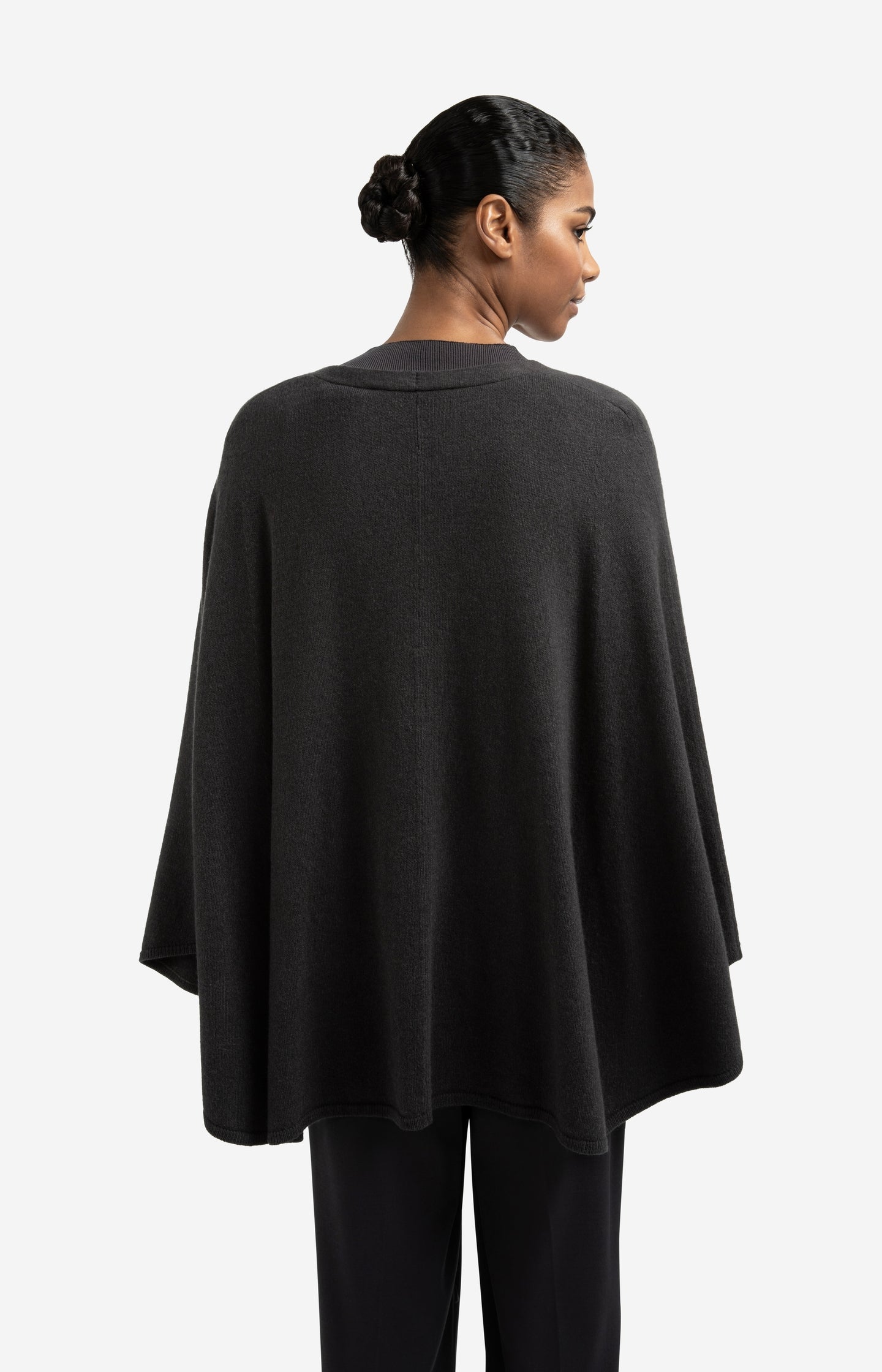 Knitted poncho with tie belt