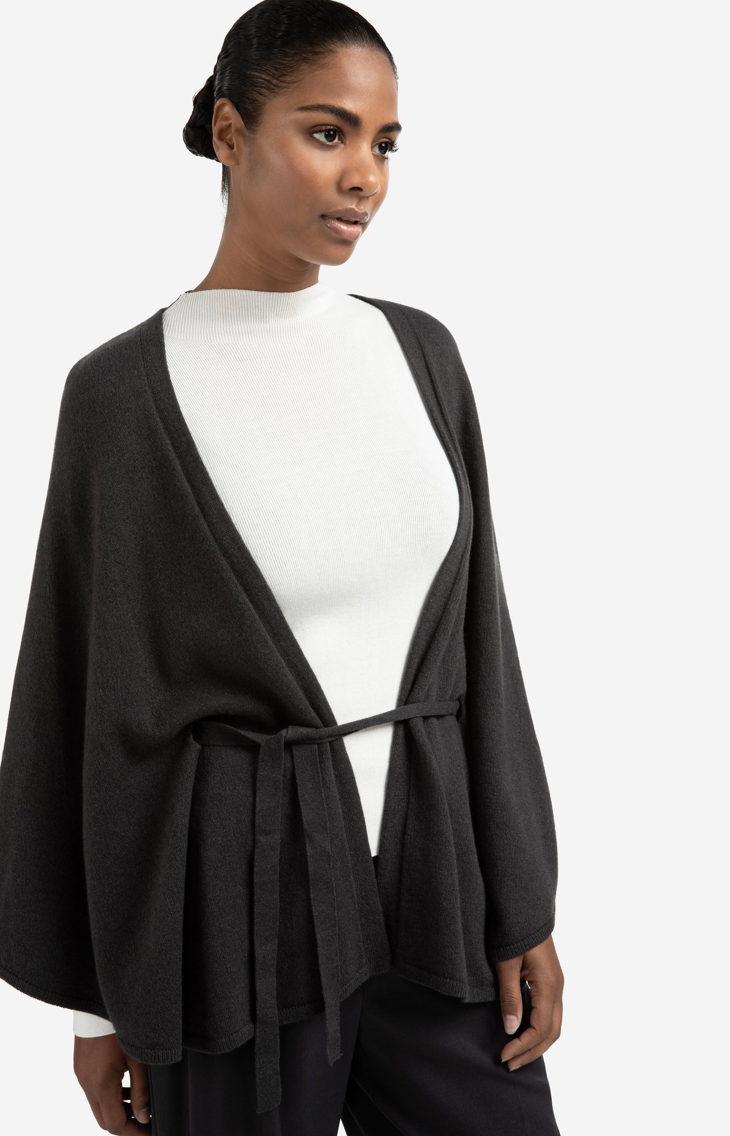 Knitted poncho with tie belt