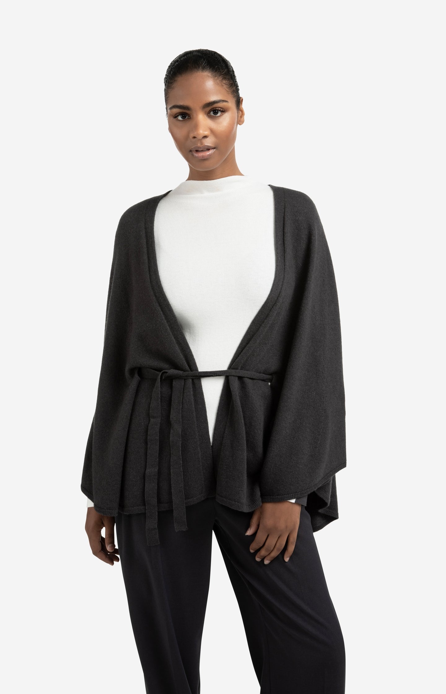Knitted poncho with tie belt