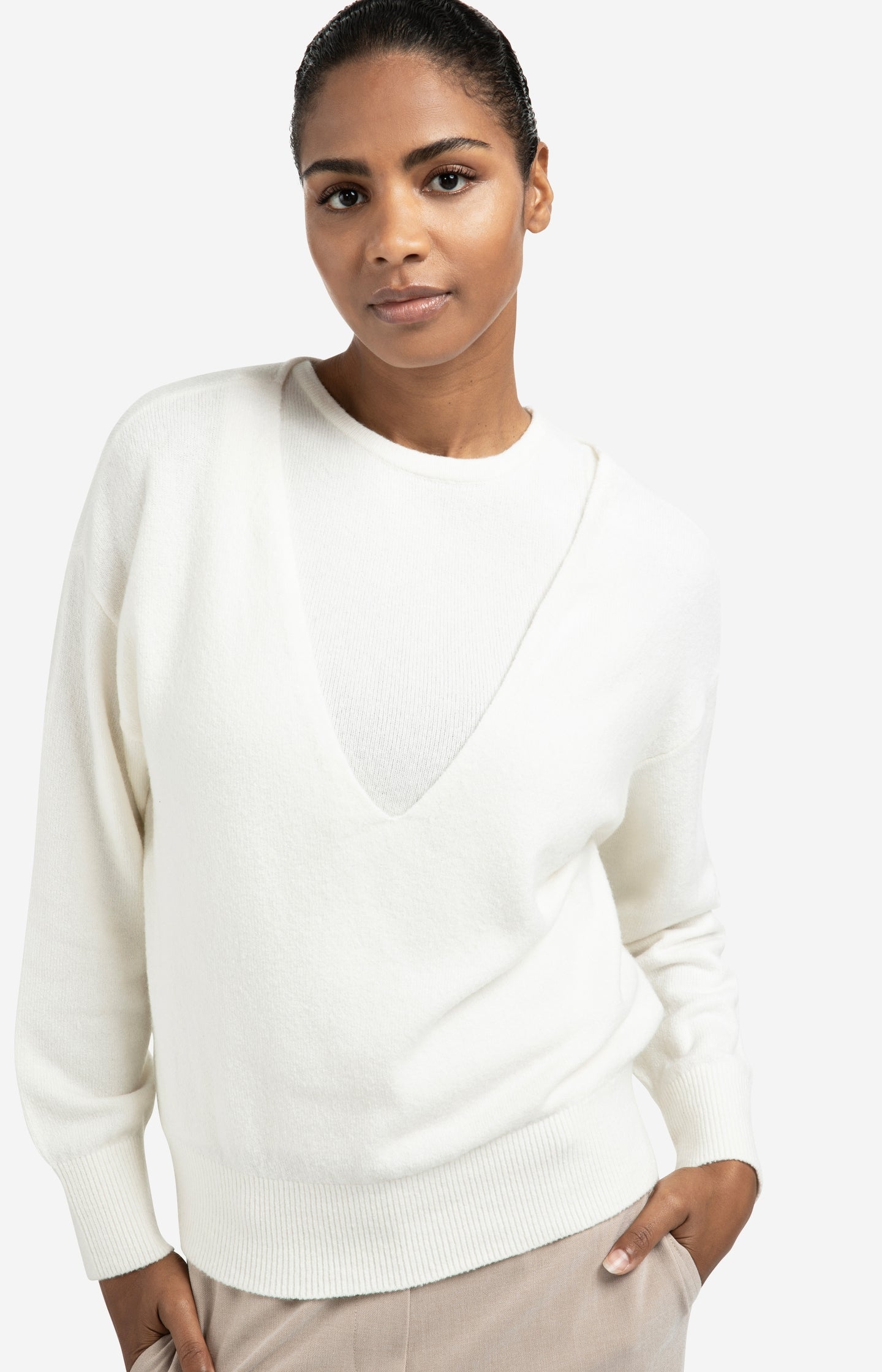 Knitted sweater with deep V-neck and layered top