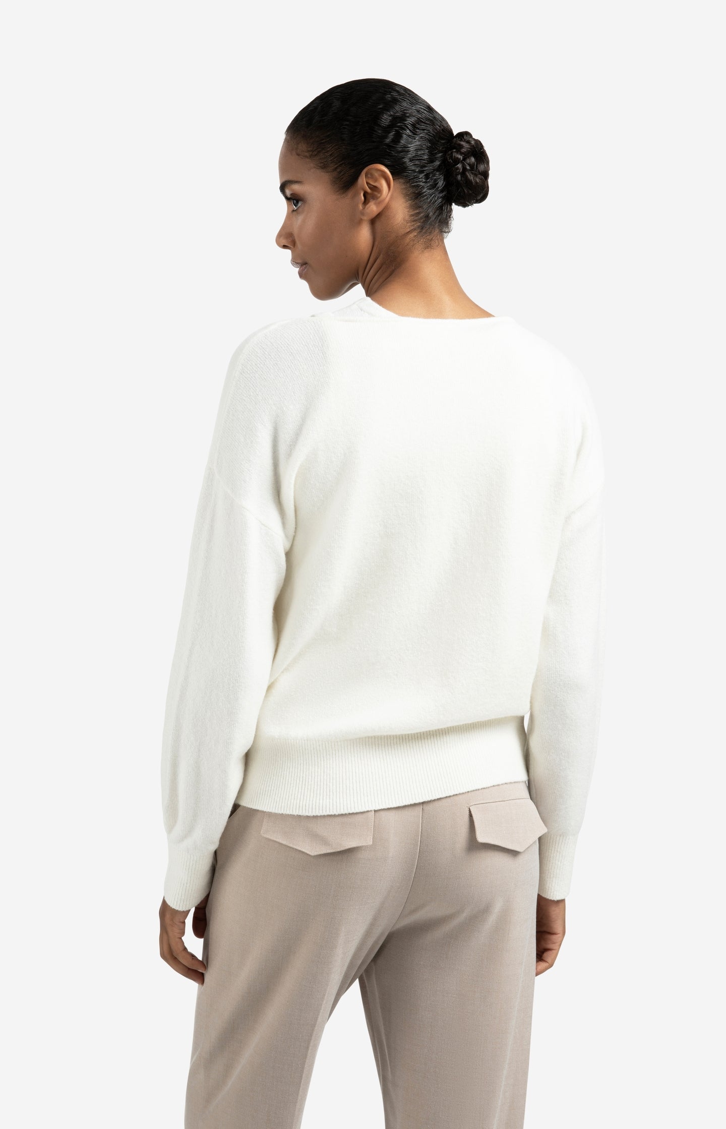 Knitted sweater with deep V-neck and layered top