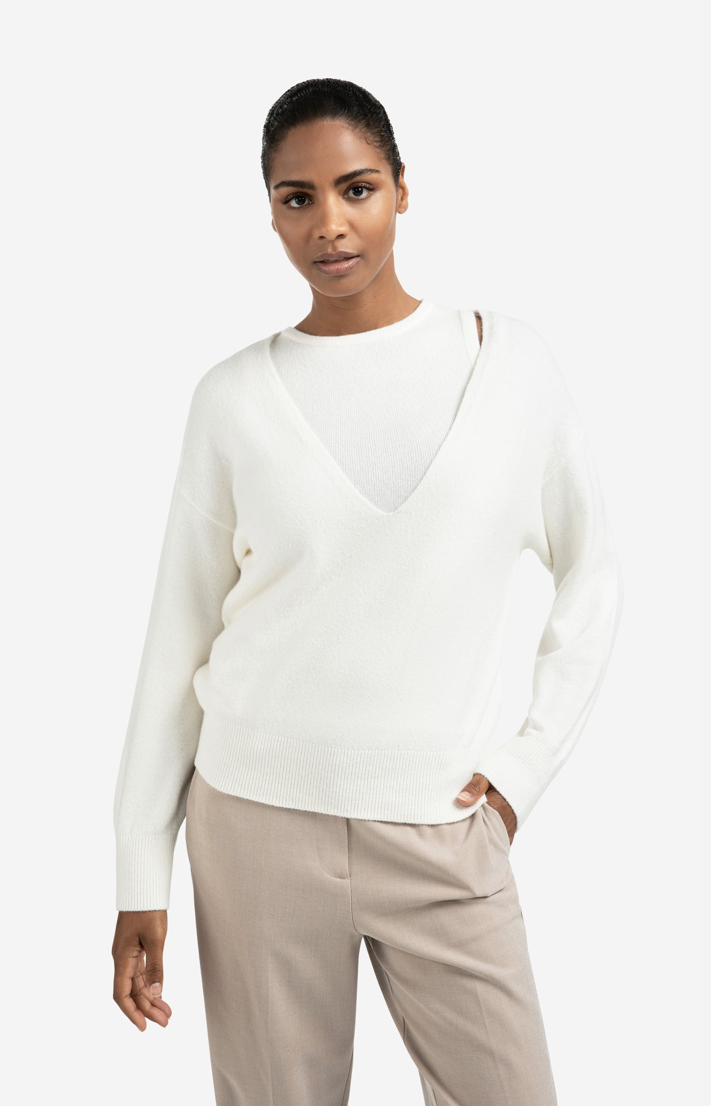 Knitted sweater with deep V-neck and layered top