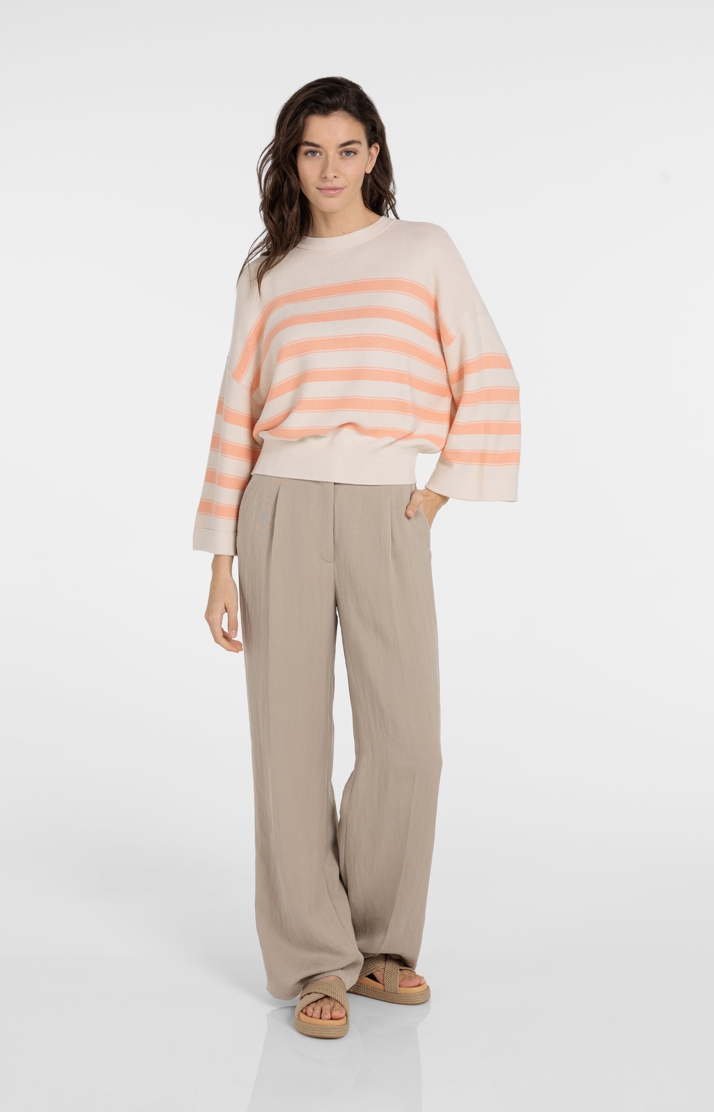 Knitted sweater with stripes and wide sleeves