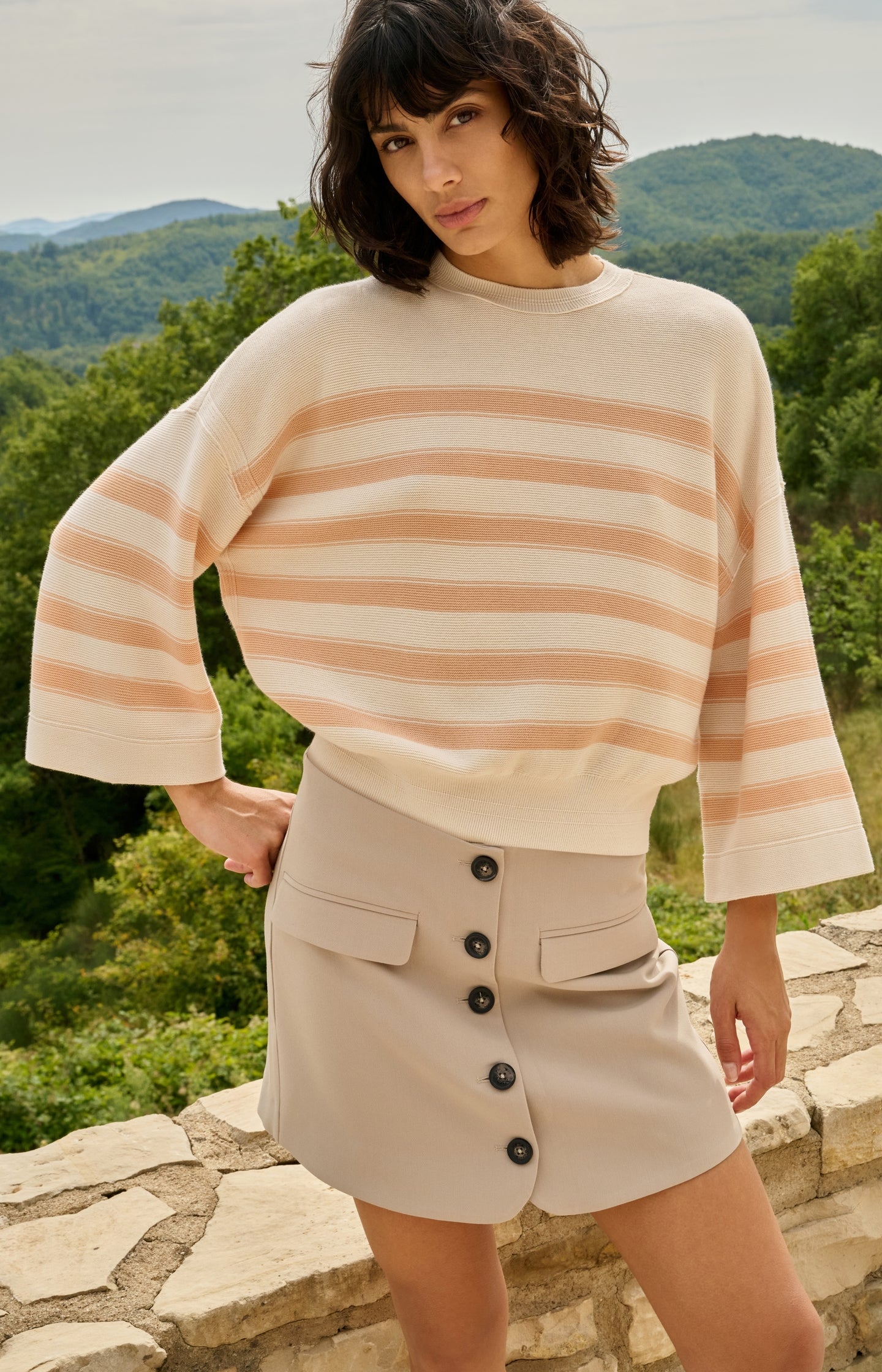 Knitted sweater with stripes and wide sleeves