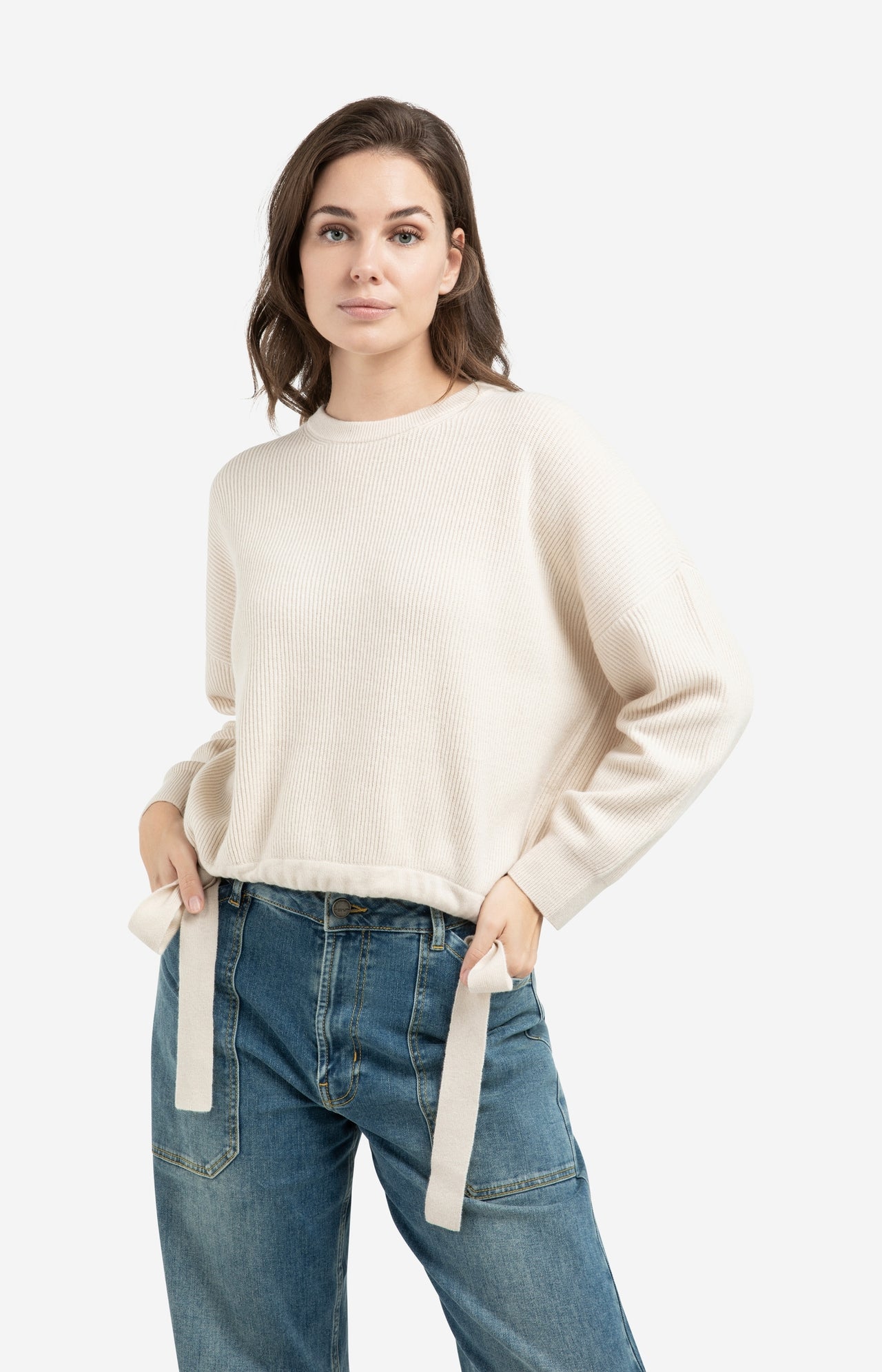 Knitted sweater with tie details at the hem
