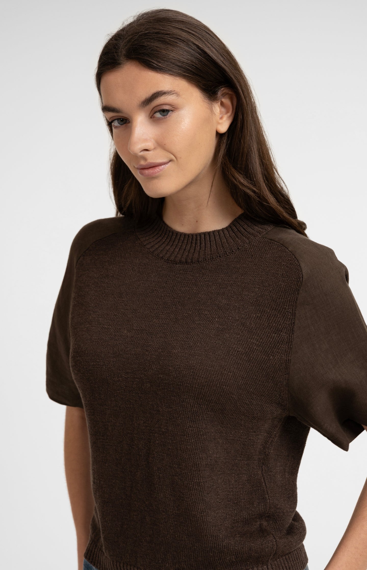 Knitted top with short sleeves and ribbed neckline