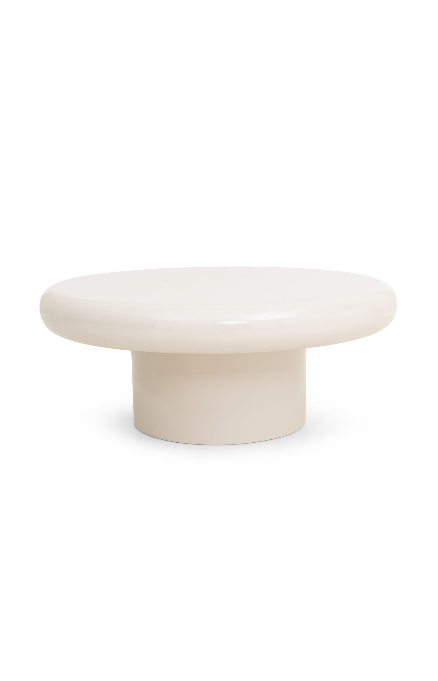 Large round coffee table with glossy finish