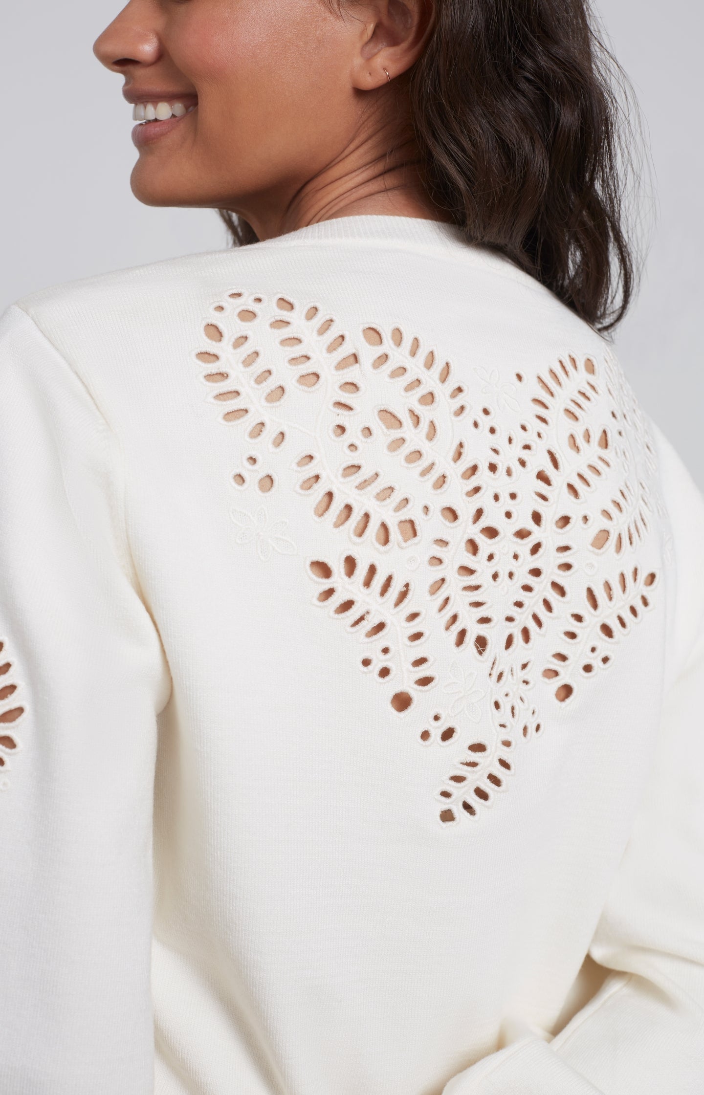 Laser cut sweater with round neck, long detailed puff sleeve