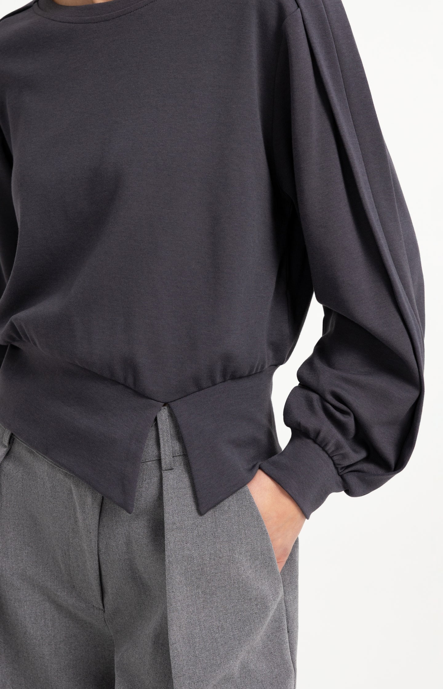 Lightweight sweater with waistband and folded detail