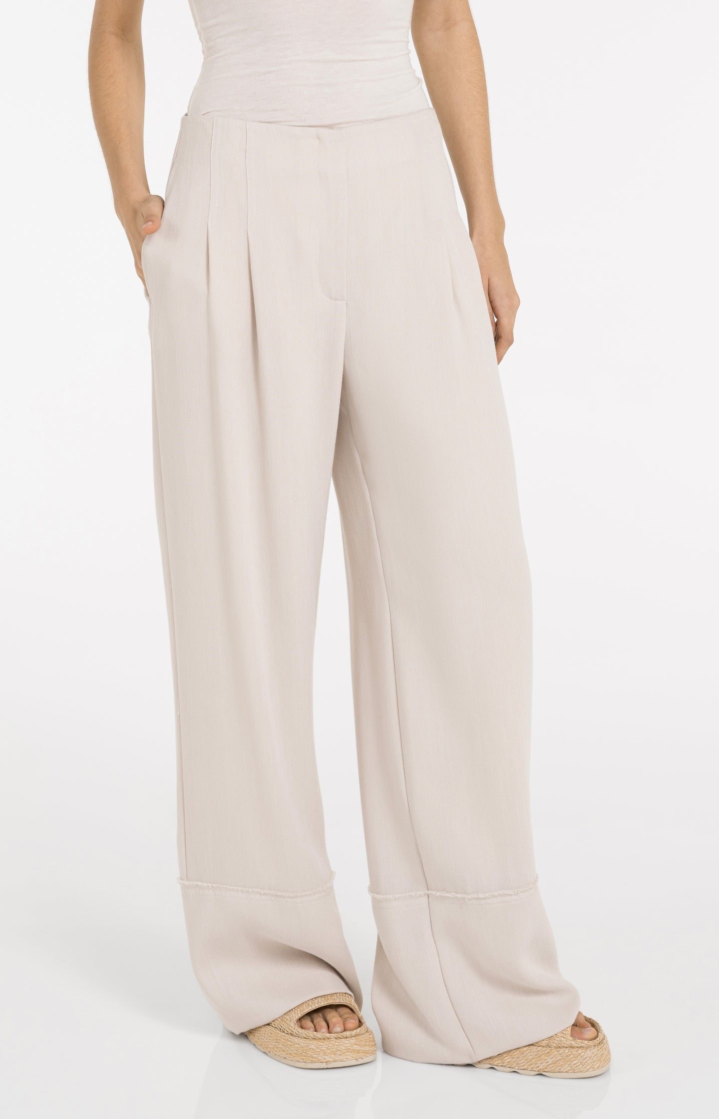 Linen blend trousers with wide legs and fringed details