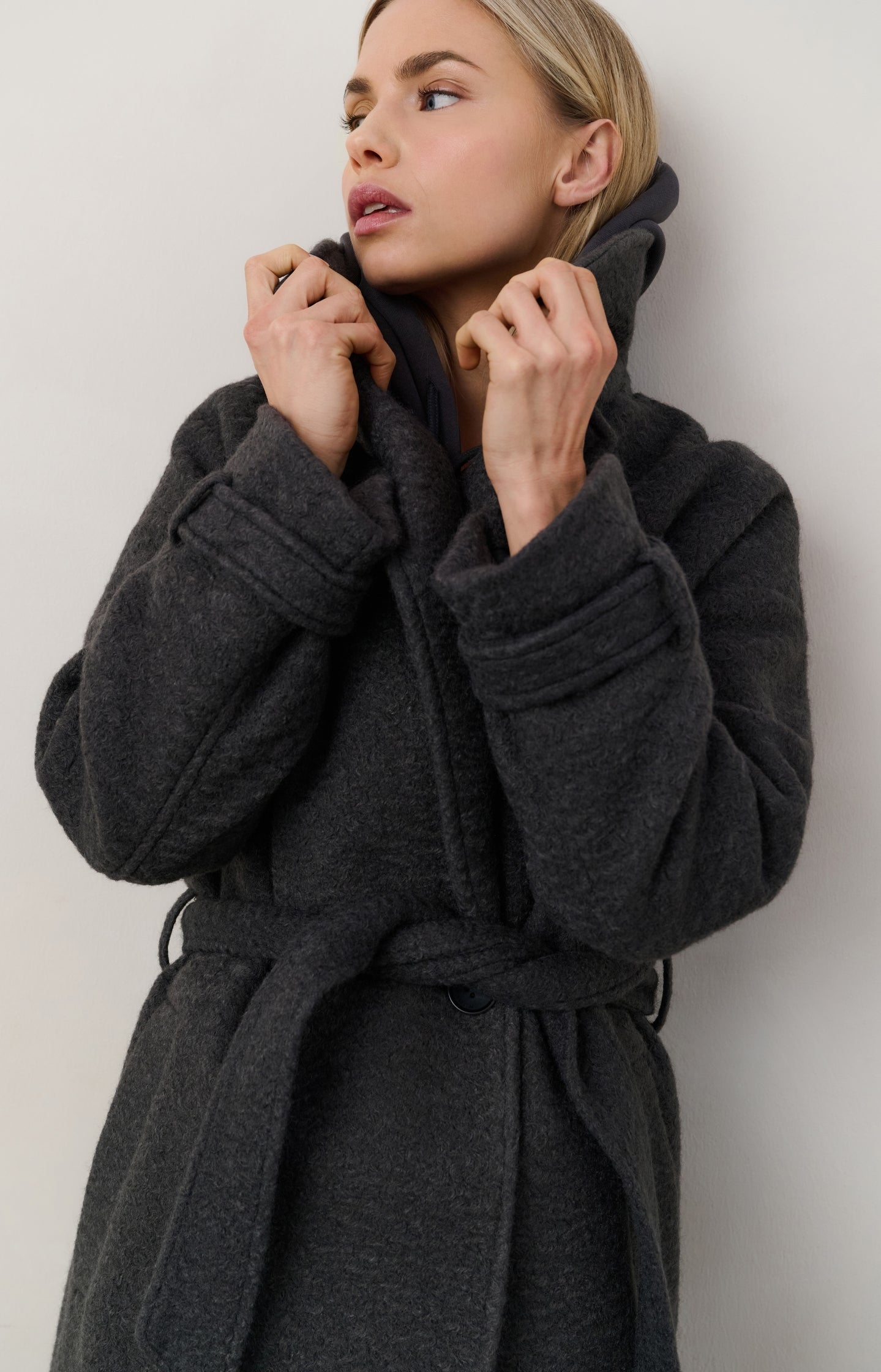 Long bouclé coat with belt and oversized fit
