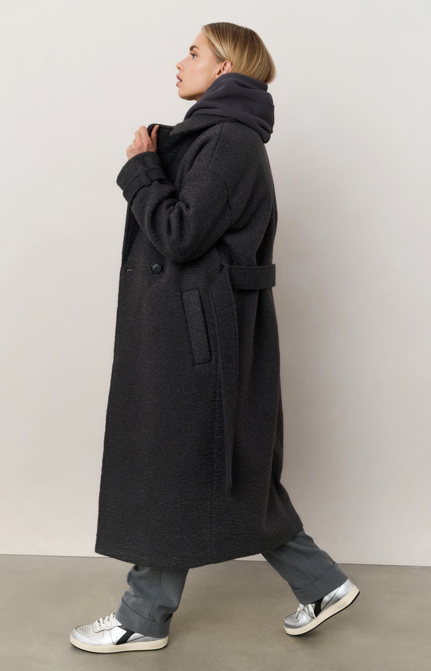 Long bouclé coat with belt and oversized fit