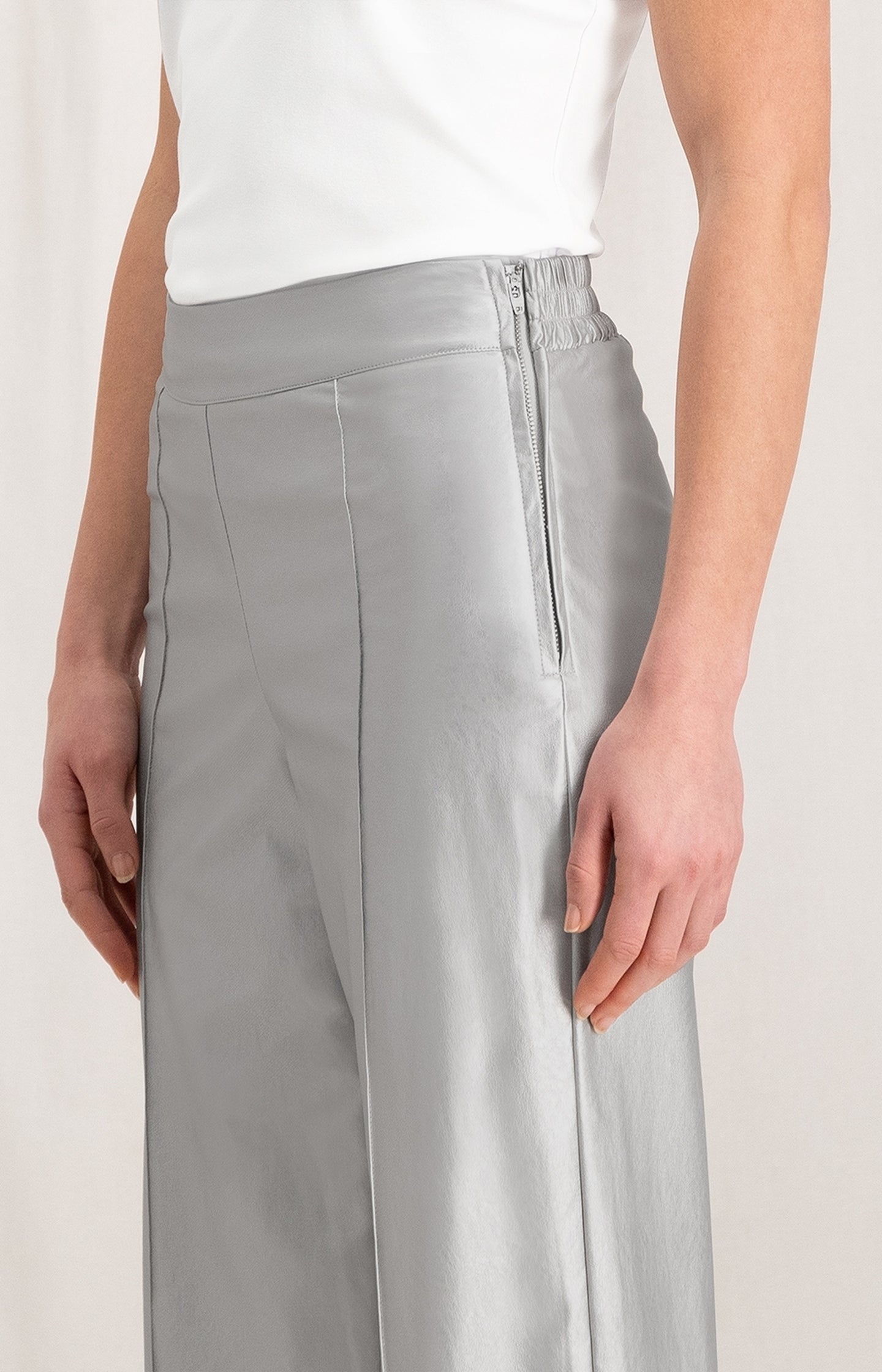 Metallic faux leather trousers with wide leg and zip