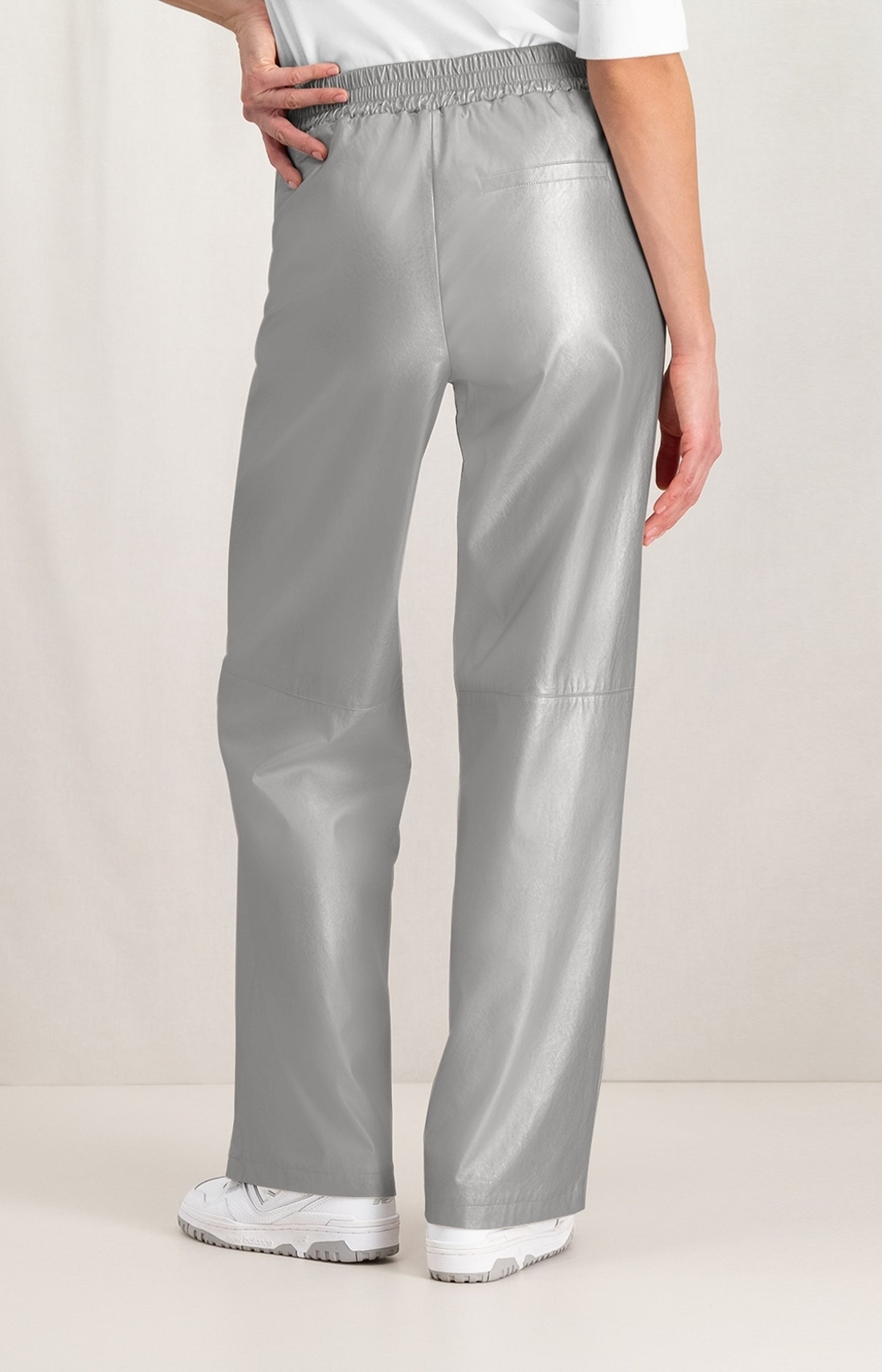 Metallic faux leather trousers with wide leg and zip