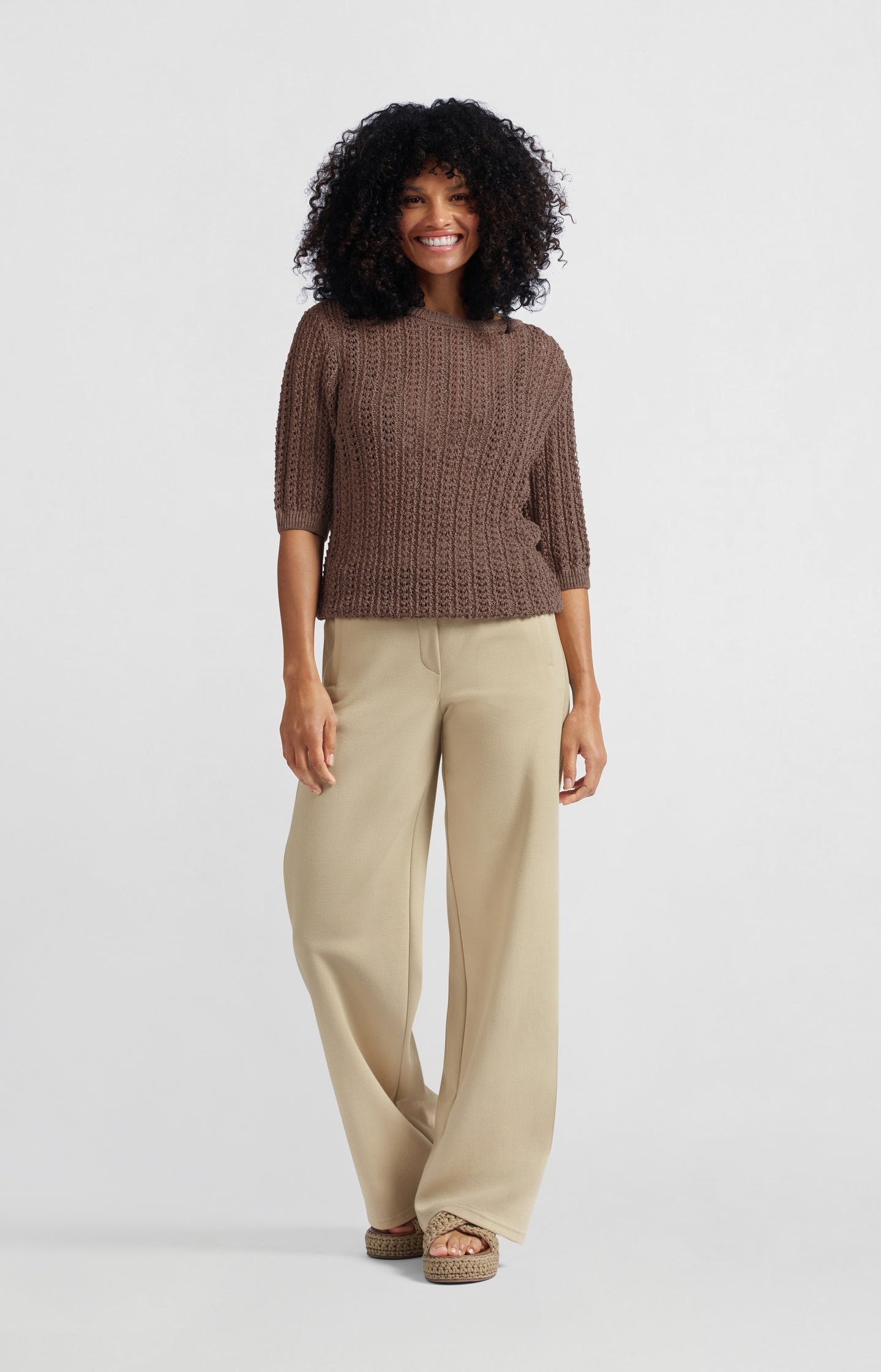 Open-knit sweater with half-length sleeves