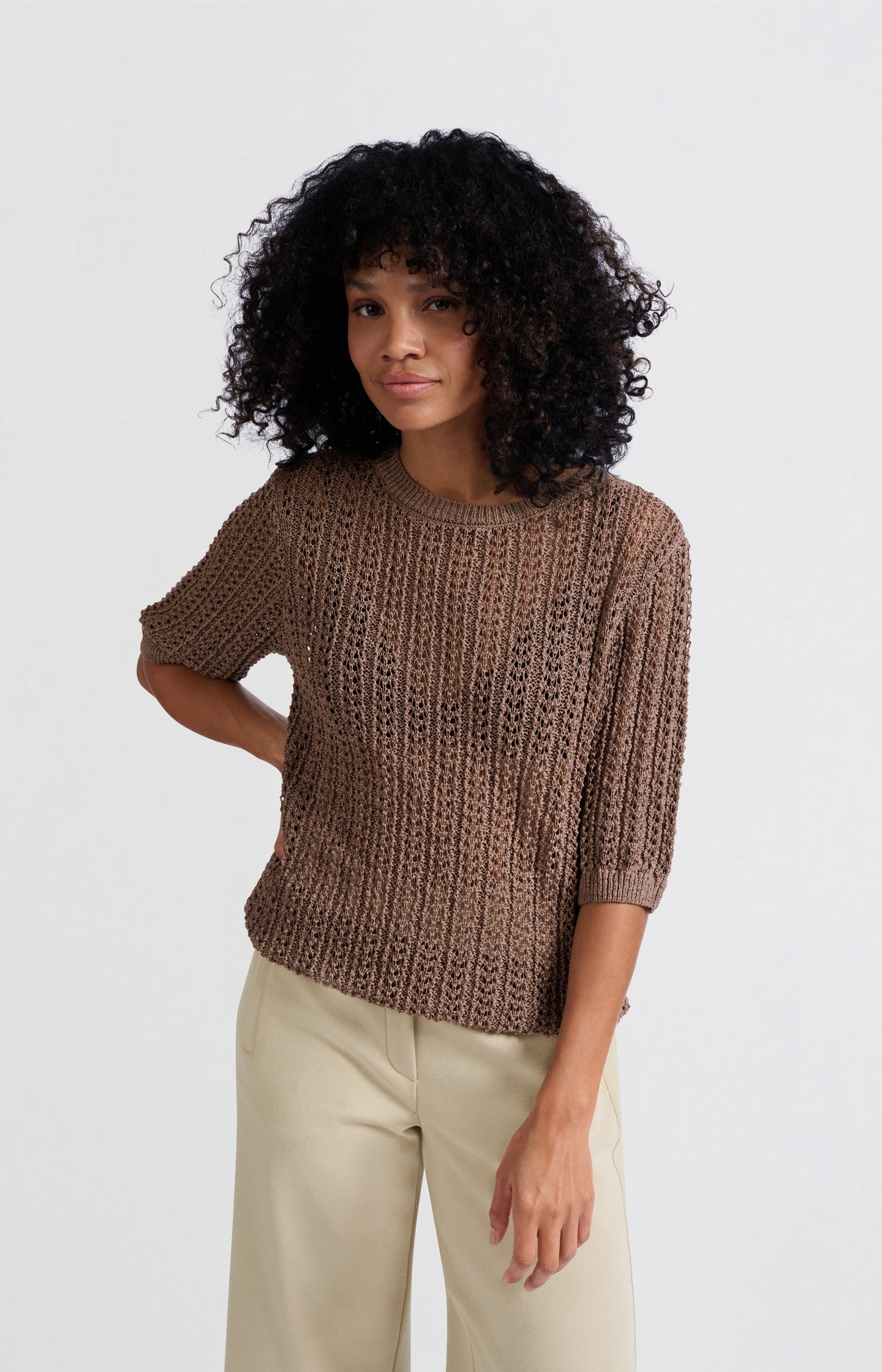 Open-knit sweater with half-length sleeves