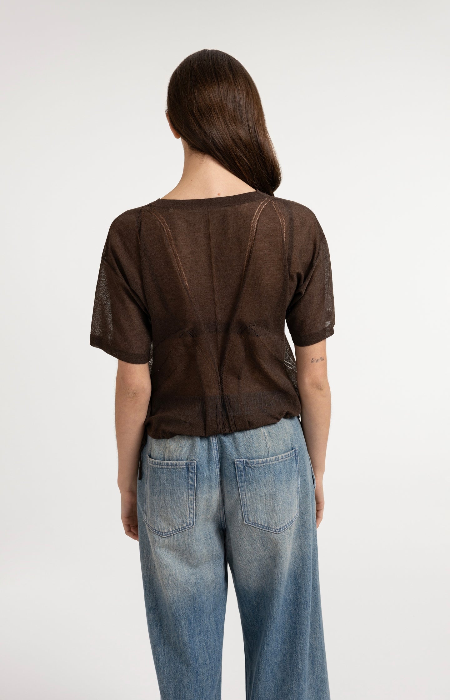 Open-knit top with ajour pattern and tie details
