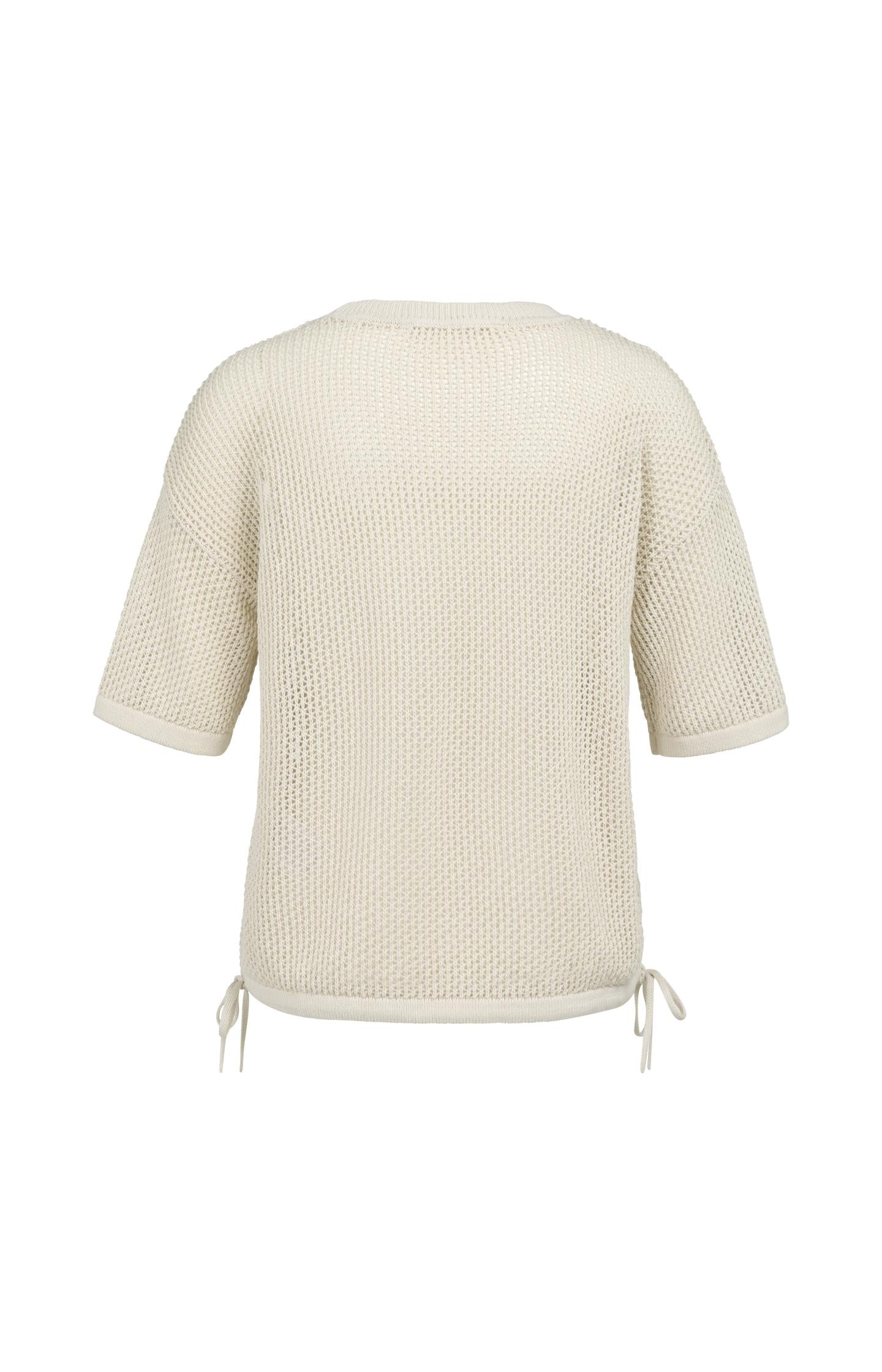 Open-knit top with short sleeves and artwork